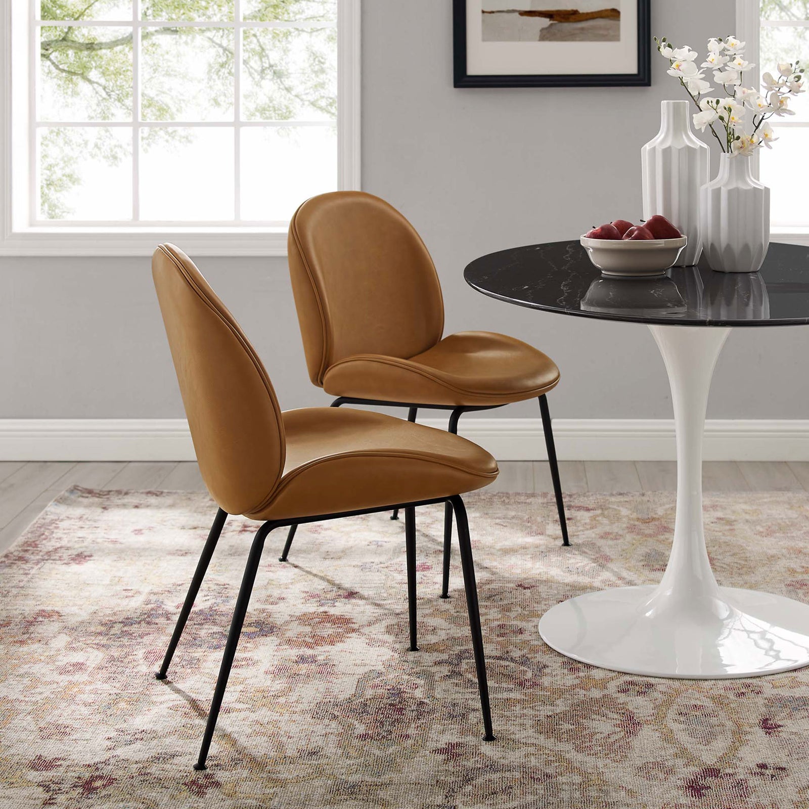 Tan Scoop dining chairs paired with a modern round dining table in a bright room setting || EEI-4636-TAN || front_angle_multi_room