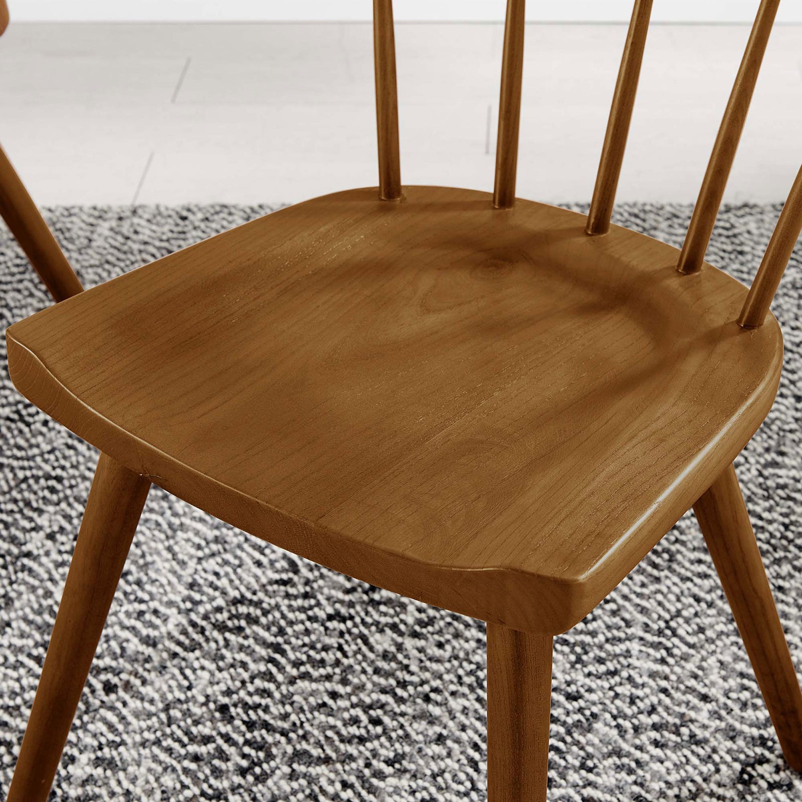 Walnut chair seat and spindled back shown over textured rug for inviting modern farmhouse style. || EEI-4650-WAL || detail_room