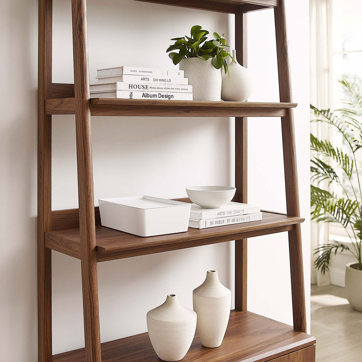 Smooth shelves and rich walnut wood grain provide an elegant showcase for books and decor || EEI-4656-WAL || detail_room