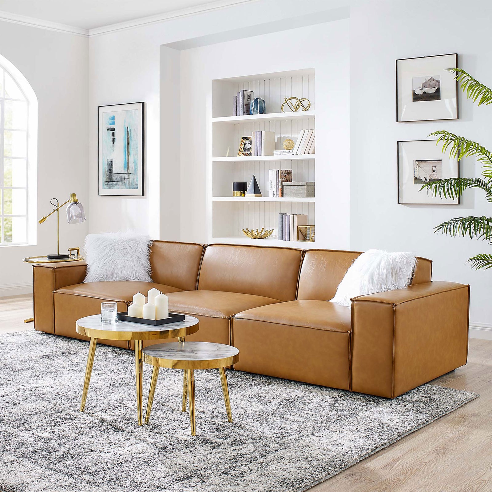 Tan vegan leather modular sofa styled with white pillows, gold tables, and a soft gray area rug || EEI-4708-TAN || front_angle_room