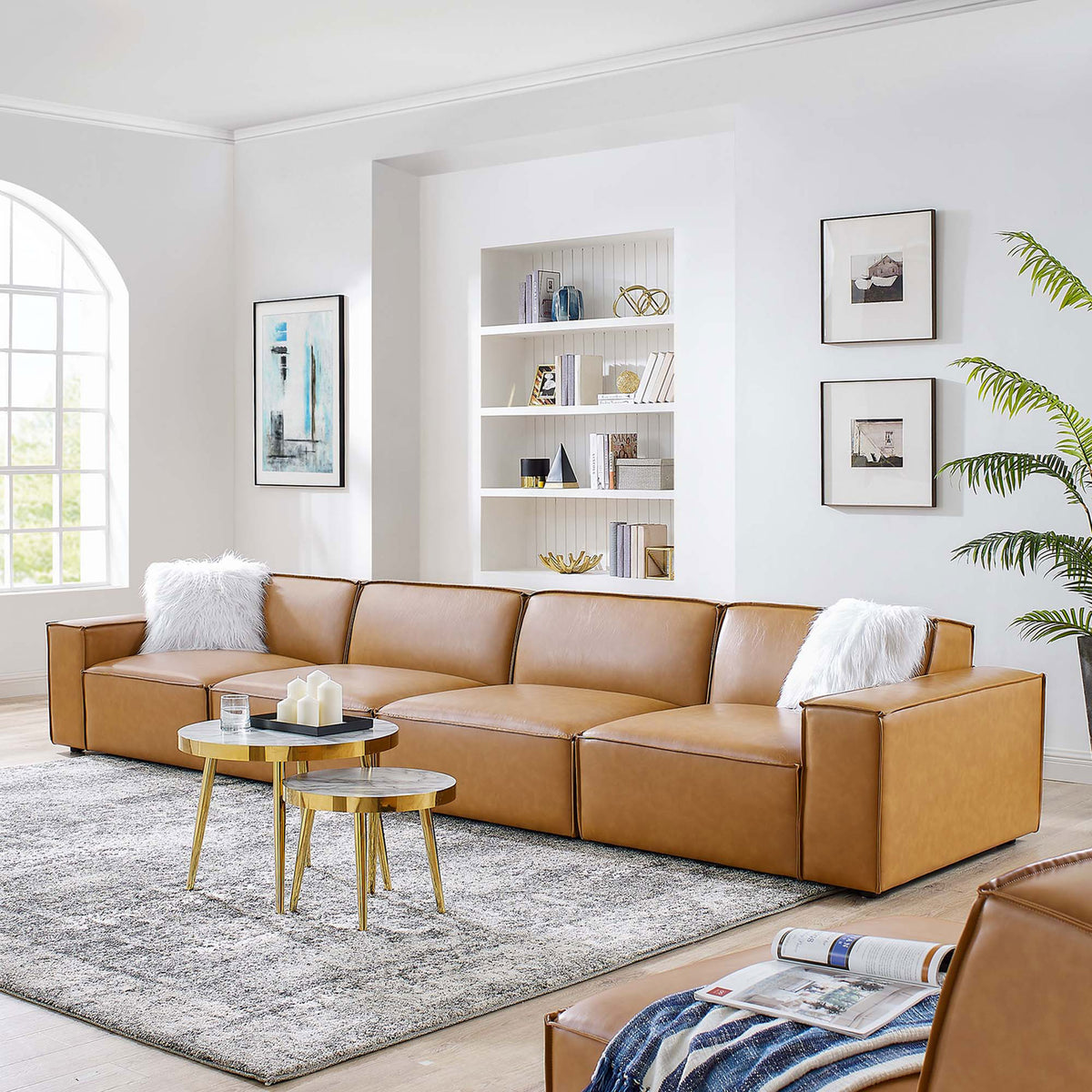 Restore tan vegan leather modular sofa styled in a bright living room with modern decor || EEI-4710-TAN || front_angle_room