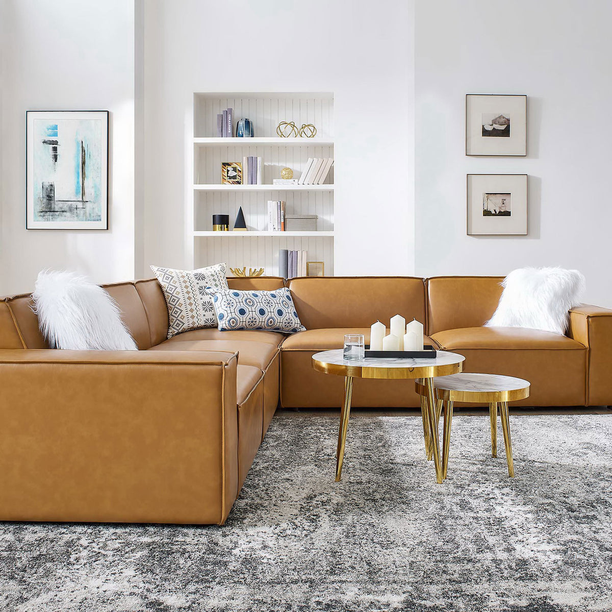 Tan vegan leather sectional styled with pillows, nesting tables, and a plush rug in a bright living room || EEI-4712-TAN || detail_room