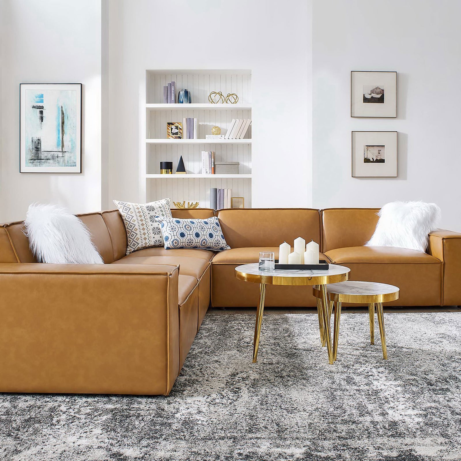 Tan vegan leather sectional styled with pillows, nesting tables, and a plush rug in a bright living room || EEI-4712-TAN || detail_room