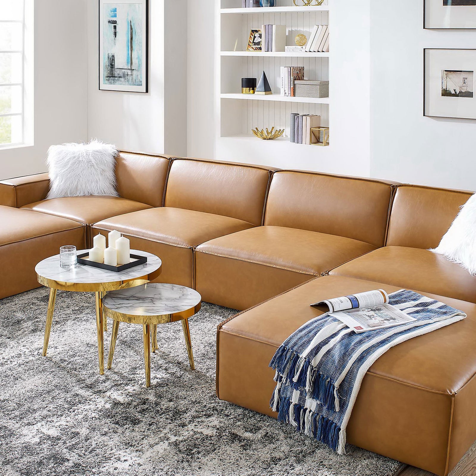 Tan vegan leather modular sectional styled with nesting tables and decor in a contemporary living room || EEI-4713-TAN || detail_room