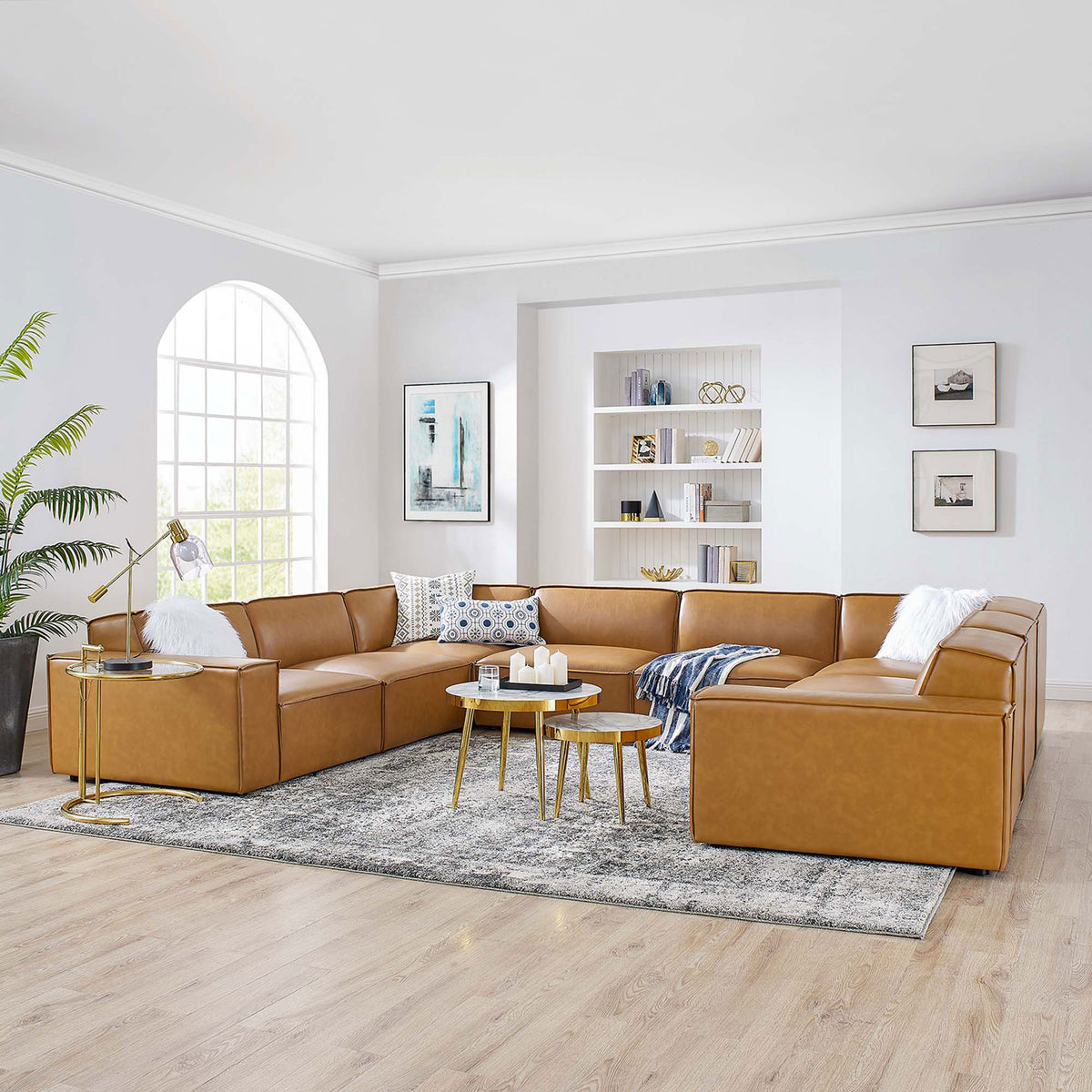 Spacious living room anchored by the tan Restore modular sectional with sleek lines and inviting, low-profile seats || EEI-4717-TAN || front_angle_room