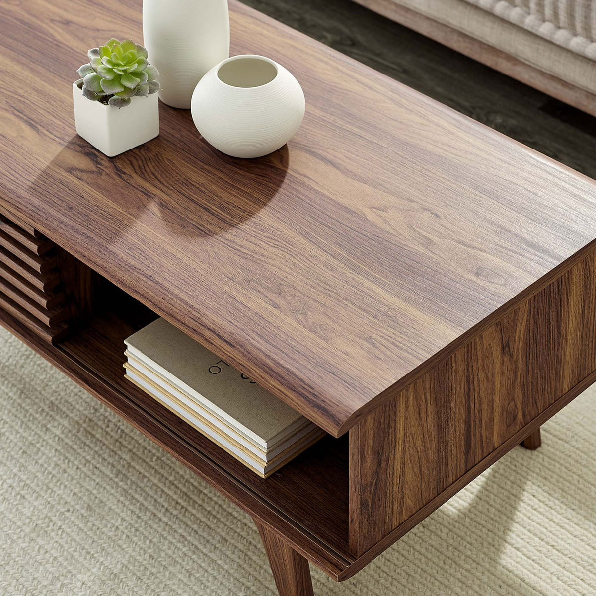 Smooth wood grain tabletop with open cubby for books and decor || EEI-4724-WAL || detail_room