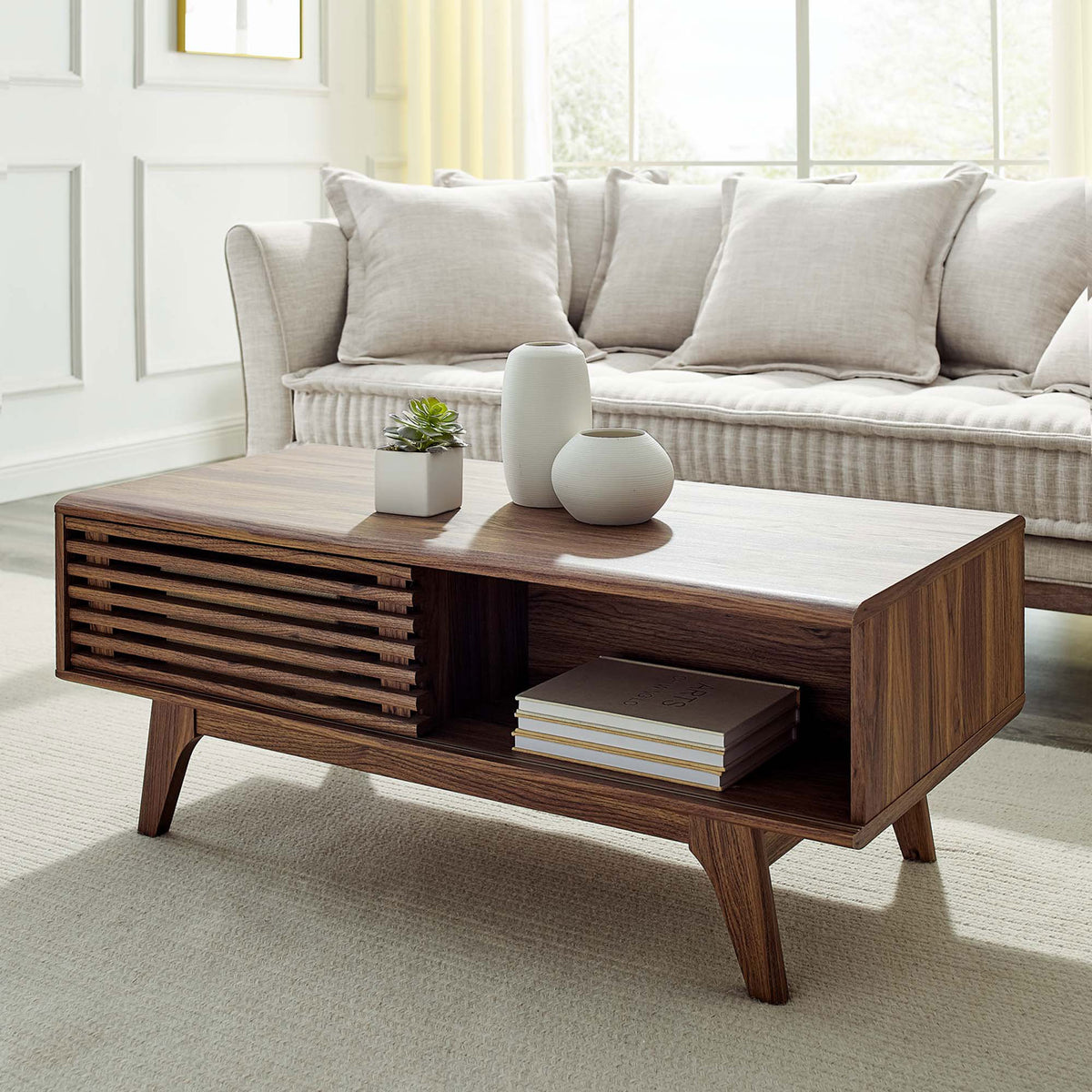 Mid-century walnut coffee table elevates the room with sliding door storage and an open shelf || EEI-4724-WAL || front_angle_room