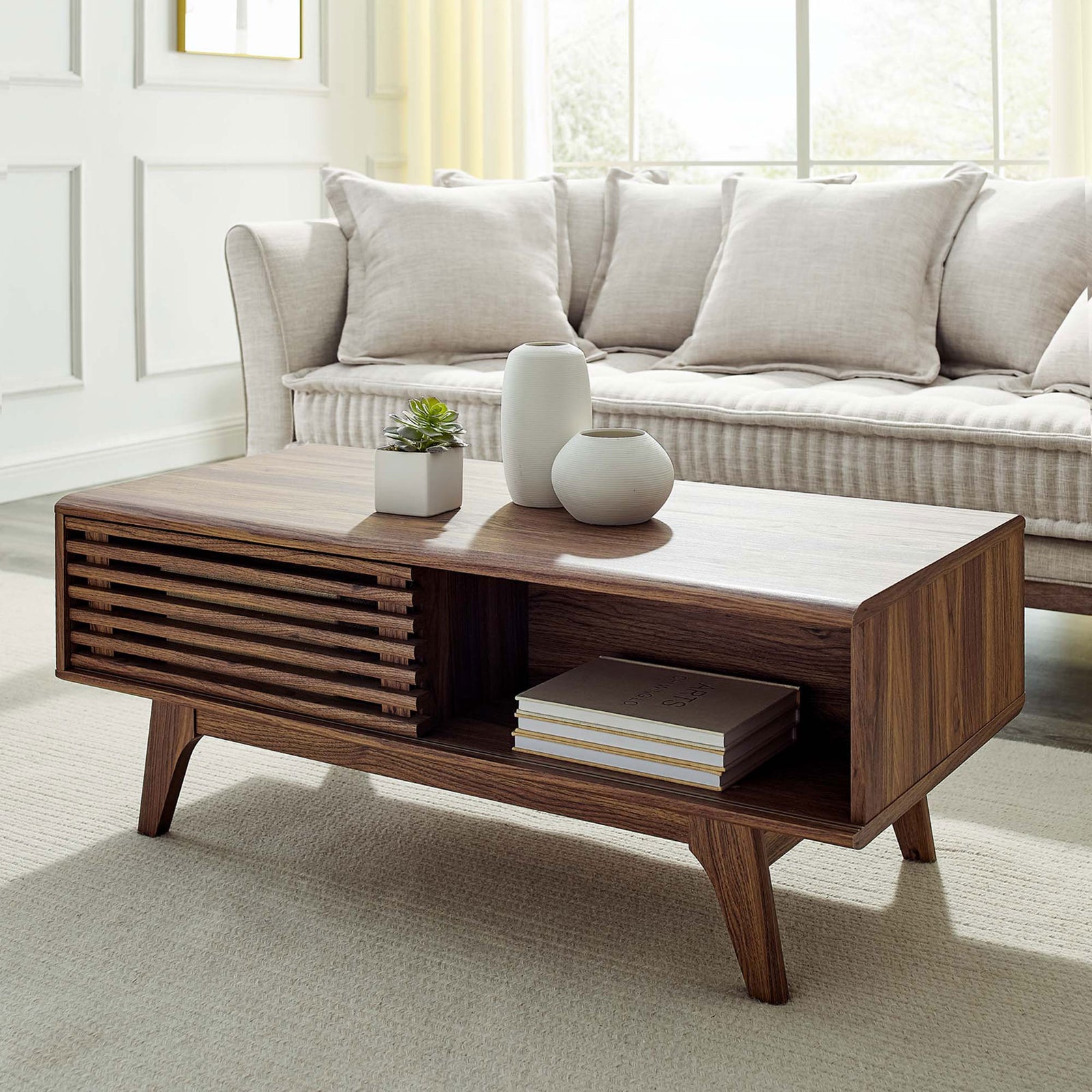 Mid-century walnut coffee table elevates the room with sliding door storage and an open shelf || EEI-4724-WAL || front_angle_room