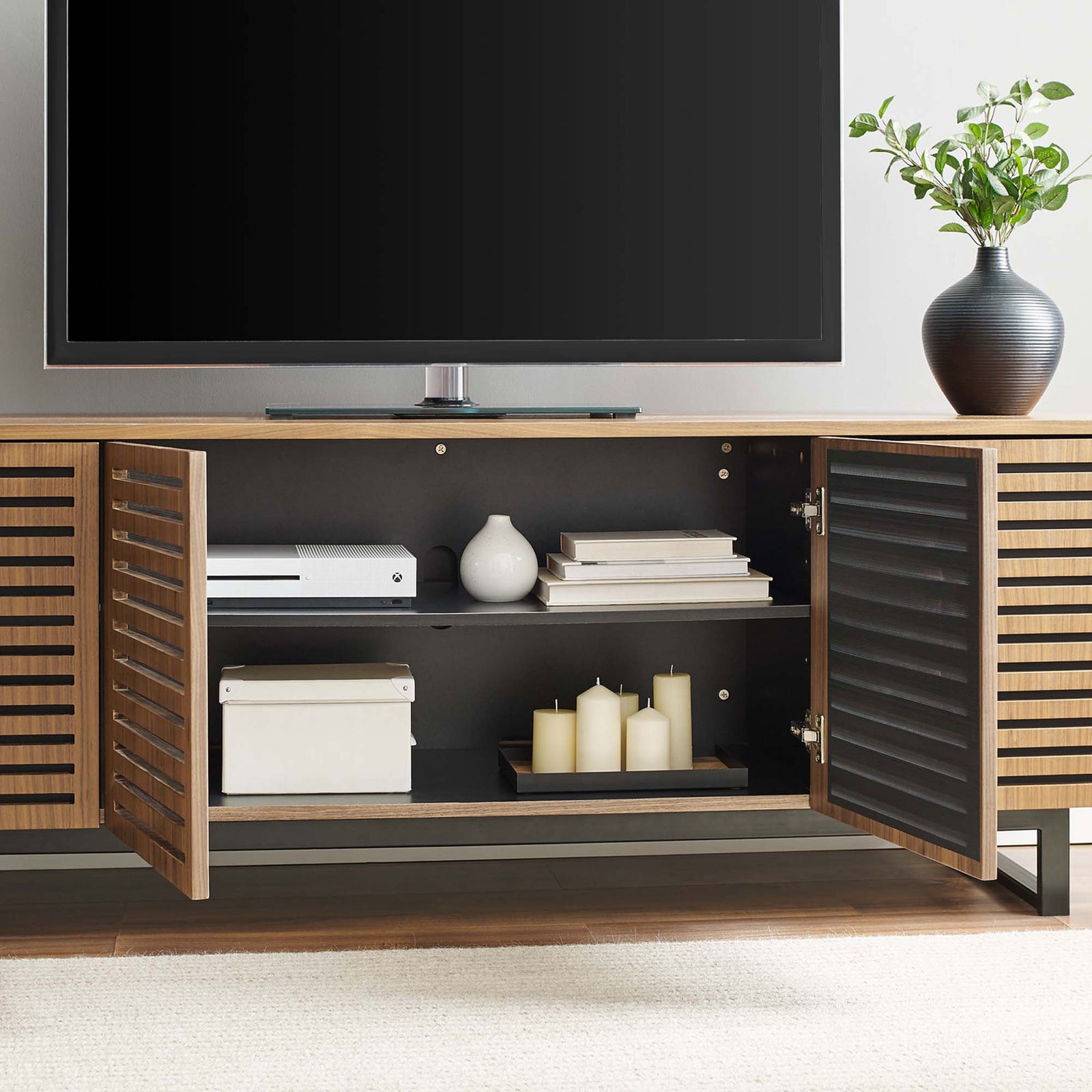 TV stand with doors open showcasing organized media storage in a modern living room || EEI-4763-WAL || front_open_room