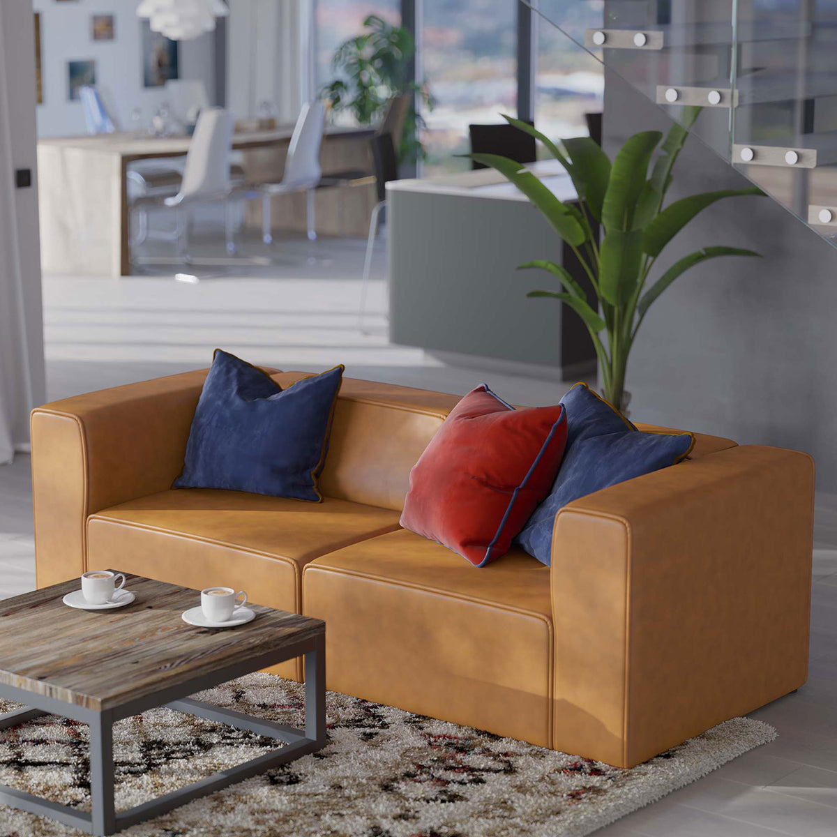 Tan vegan leather loveseat arranged with colorful accent pillows beside a rustic coffee table in a bright living room || EEI-4788-TAN || front_angle_room