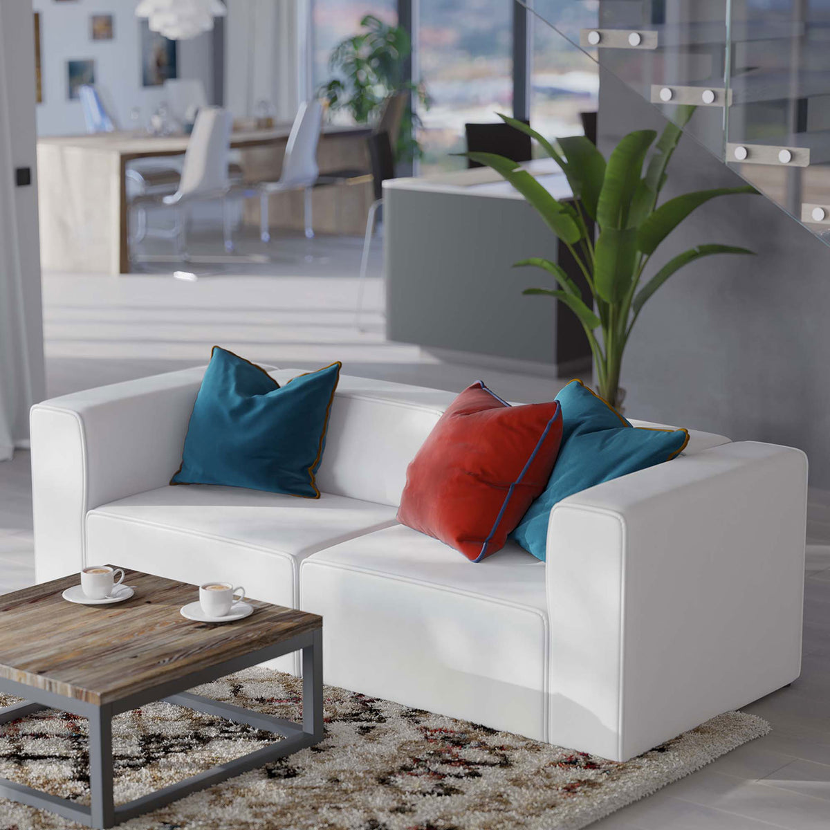 White vegan leather loveseat in airy open-plan living space with rug, table, and greenery || EEI-4788-WHI || front_angle_room