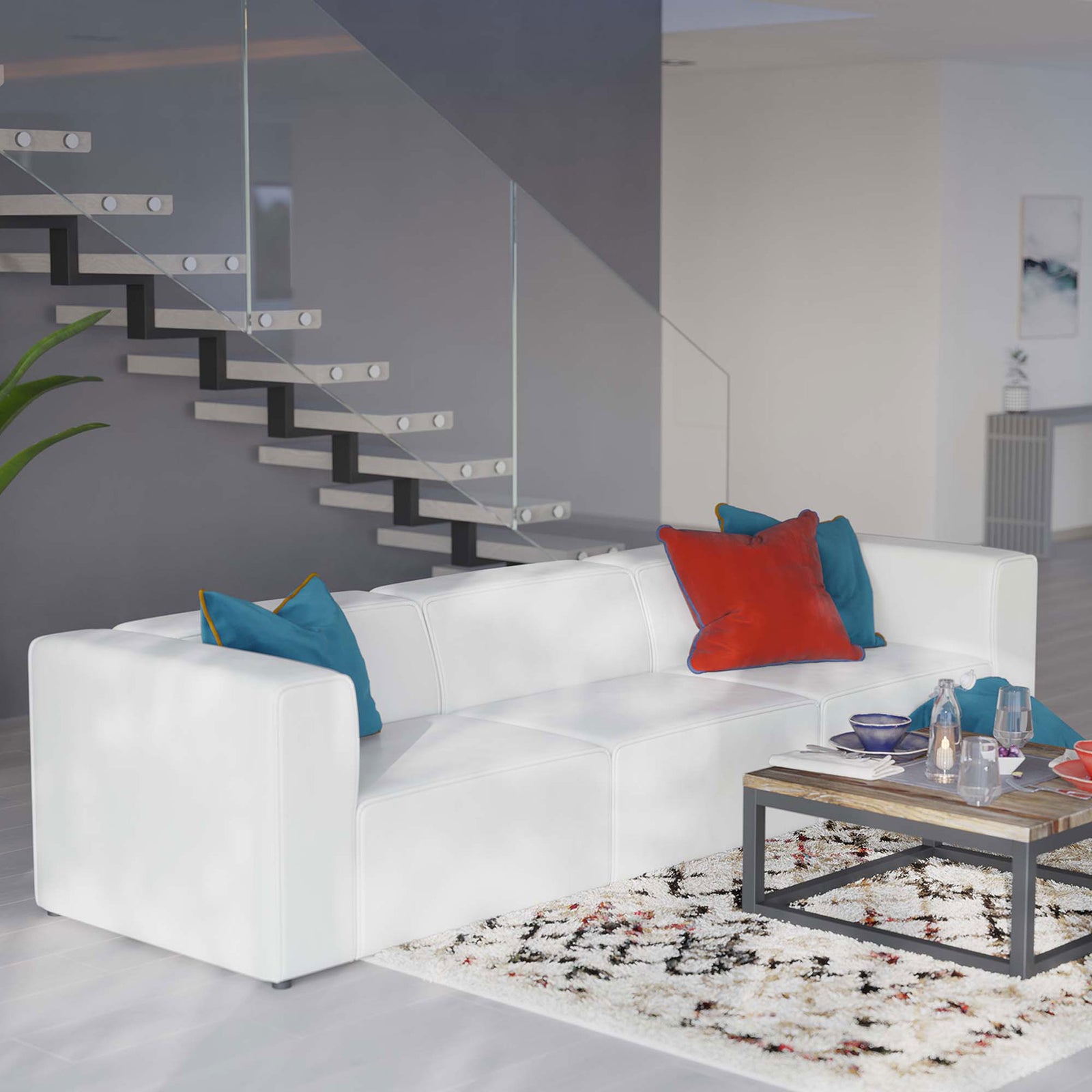 Mingle white vegan leather sectional arranged beside a sleek coffee table in a bright living space || EEI-4789-WHI || front_angle_room