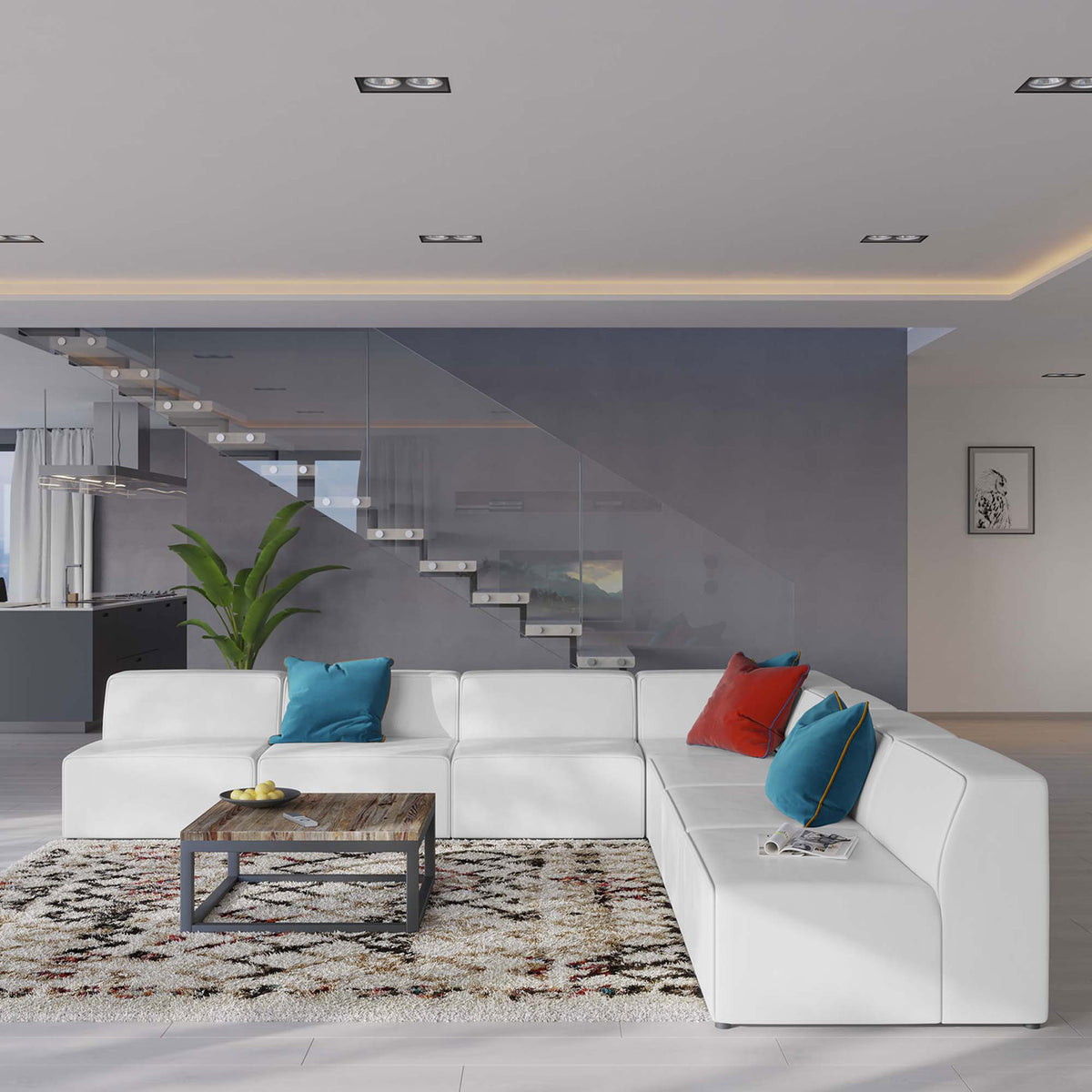 Spacious white sectional anchors a bright open-plan living area with colorful pillows and a modern coffee table || EEI-4797-WHI || front_angle_room