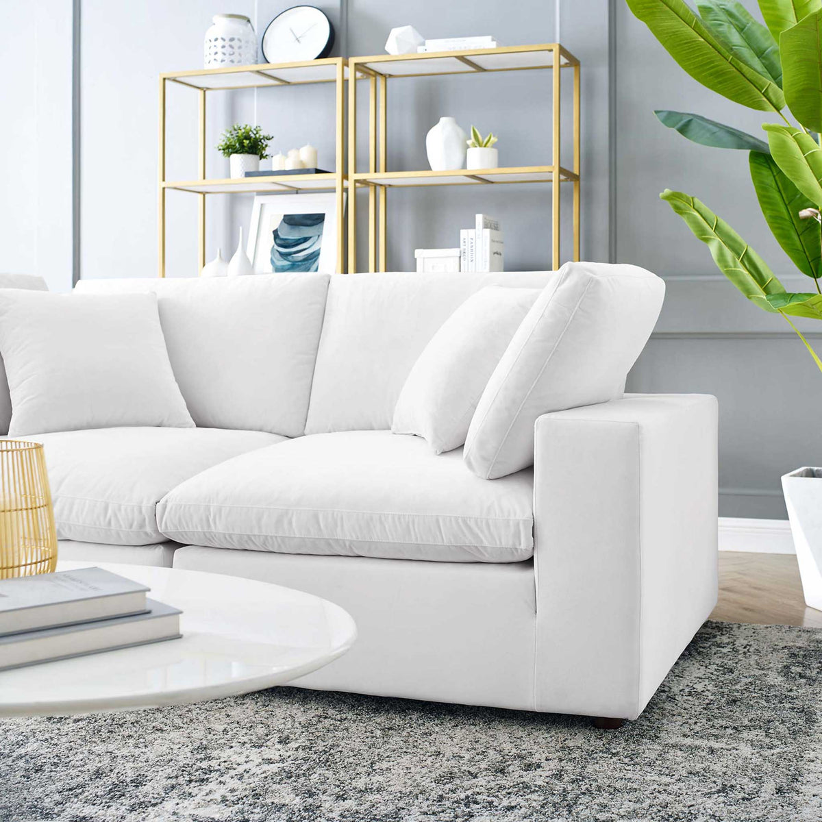 A thick white velvet seat and lofty back pillows offer relaxed, sink-in comfort