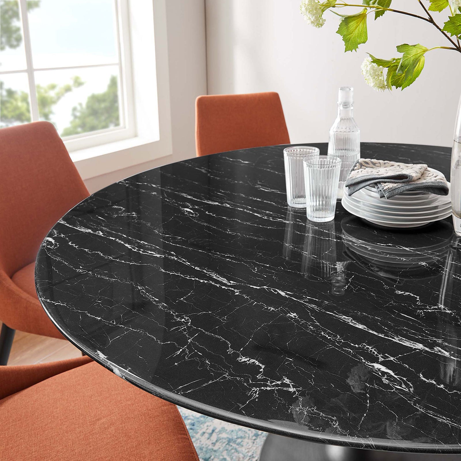 Tabletop scene on 60 inch faux marble surface with glassware, plates, and fresh flowers. || EEI-4879-BLK-BLK || detail_room