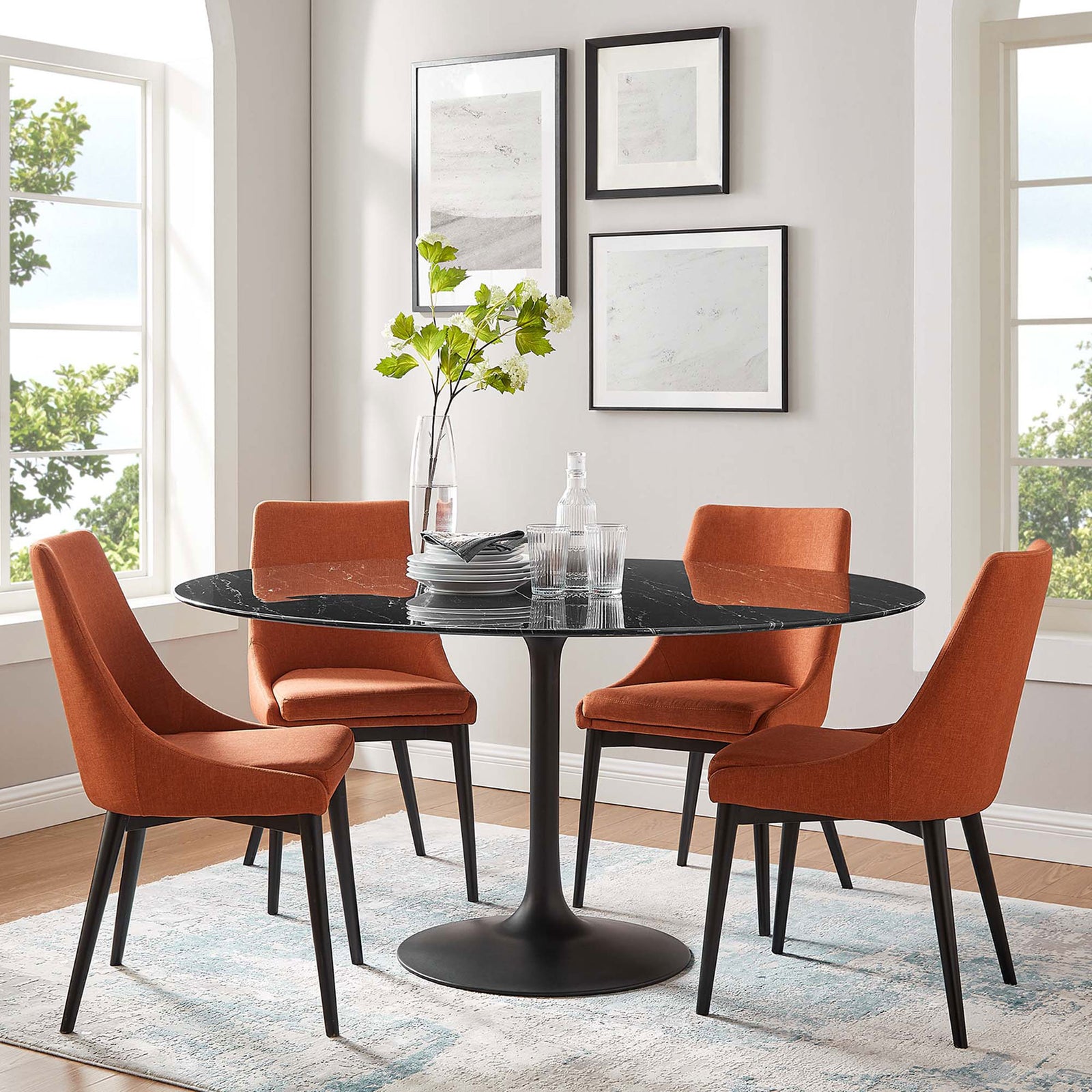 60 inch faux marble dining table paired with four orange chairs in a light filled dining space. || EEI-4879-BLK-BLK || front_room