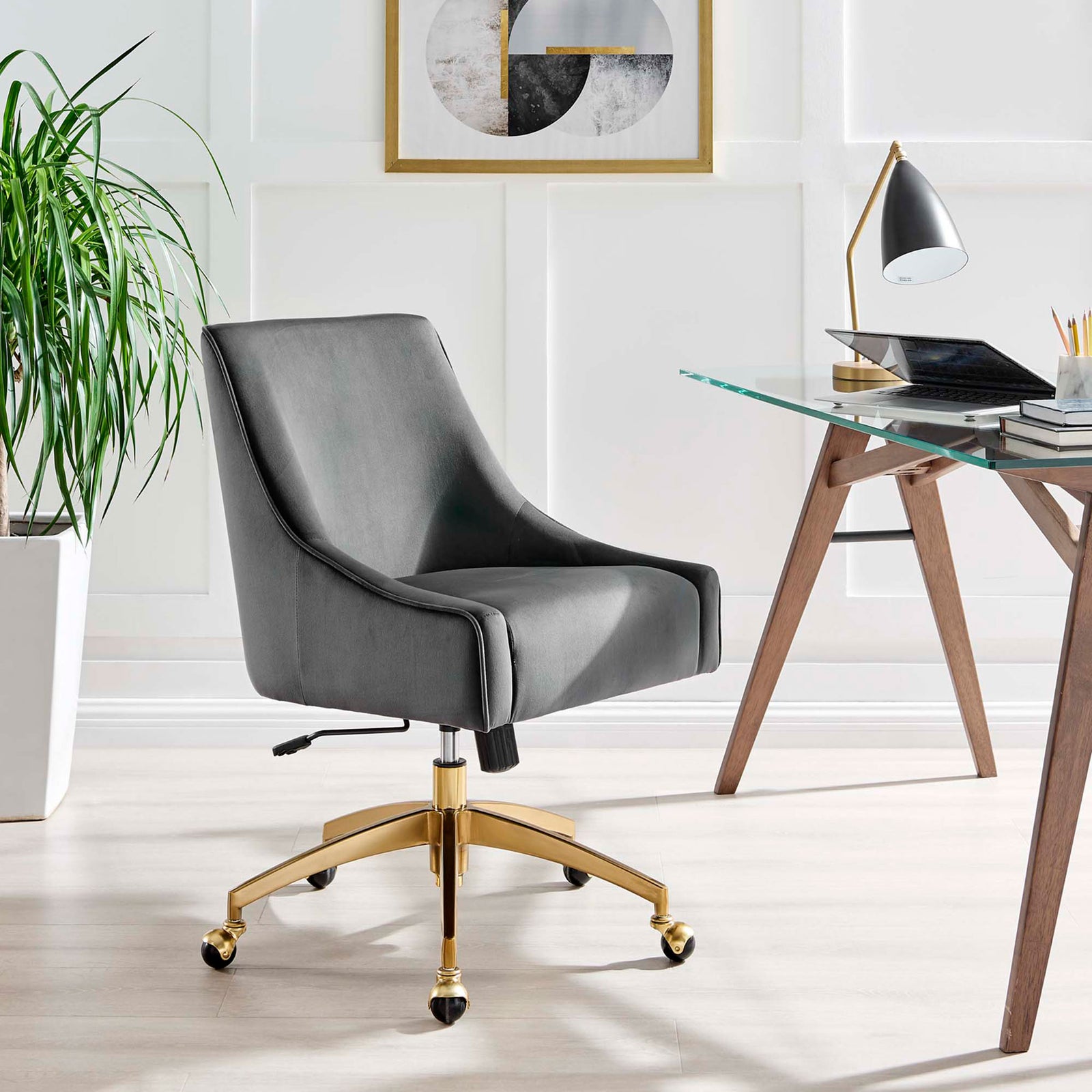 Gray velvet office chair with gold base styled beside a modern glass desk in a bright home office. || EEI-5079-GRY || front_angle_room