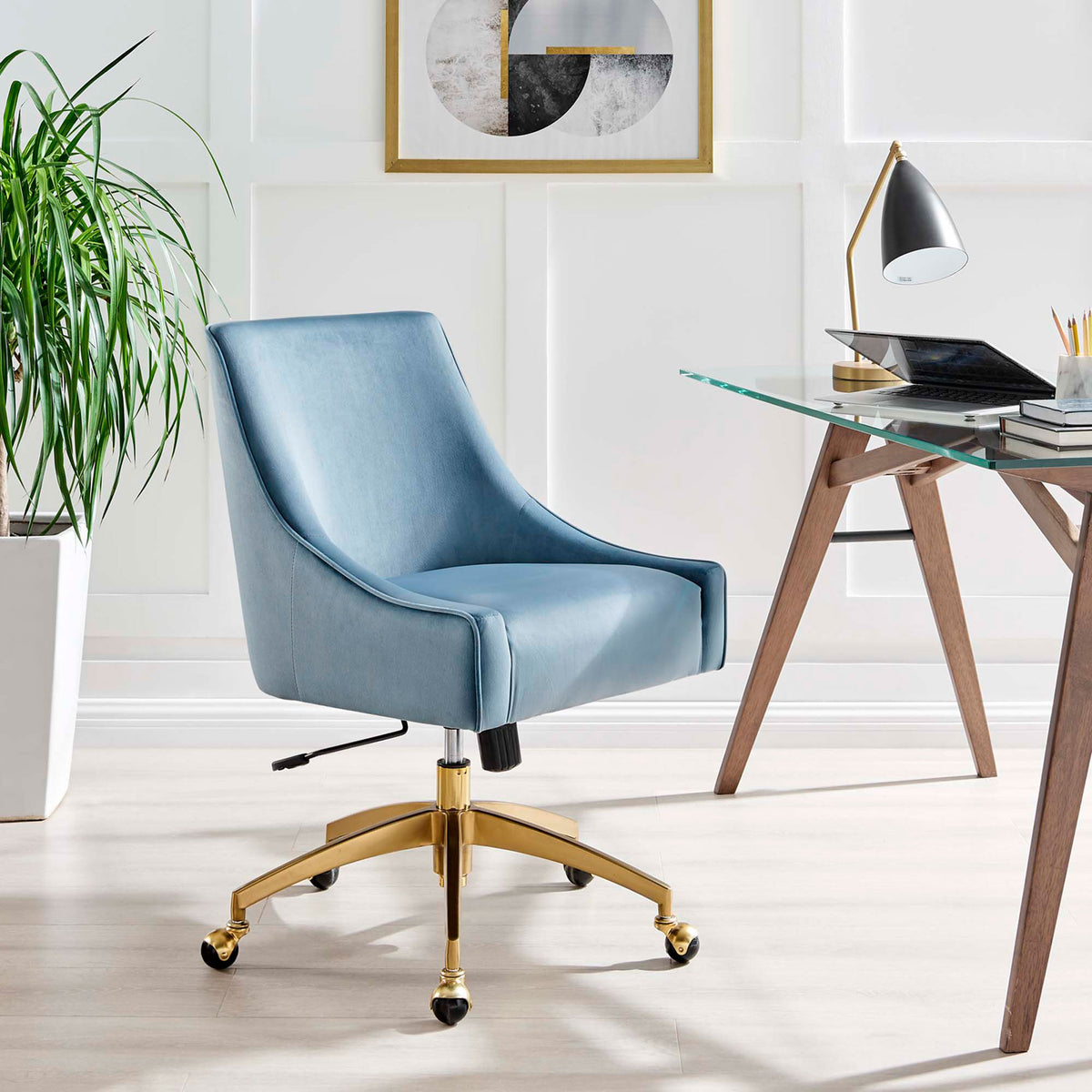 Light blue velvet office chair with gold base styled beside a modern glass desk in a bright office || EEI-5079-LBU || front_angle_room