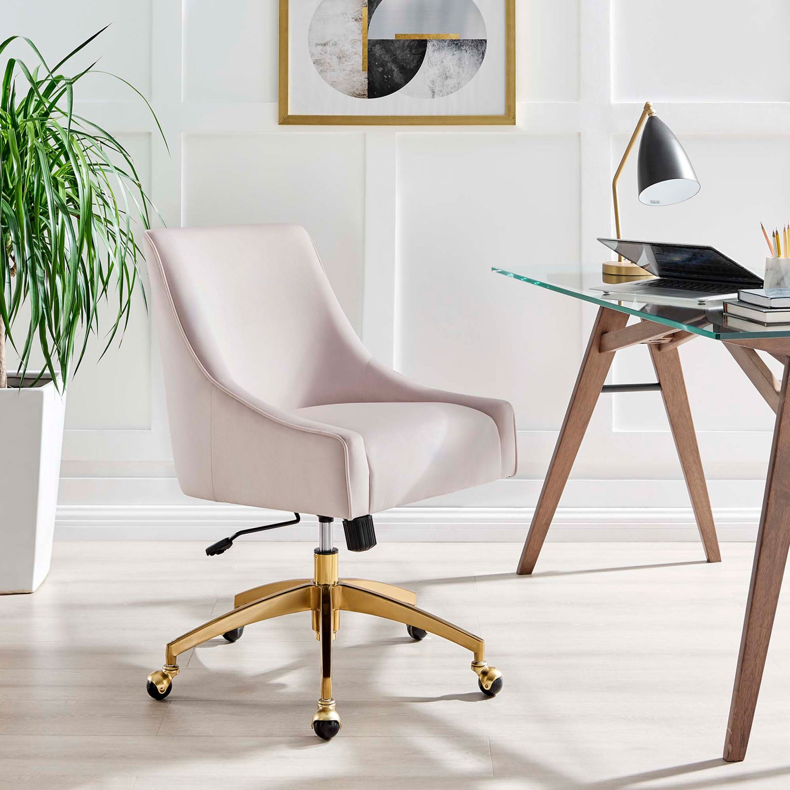 Pink velvet office chair with gold base styled beside a modern glass desk in a bright home office || EEI-5079-PNK || front_angle_room