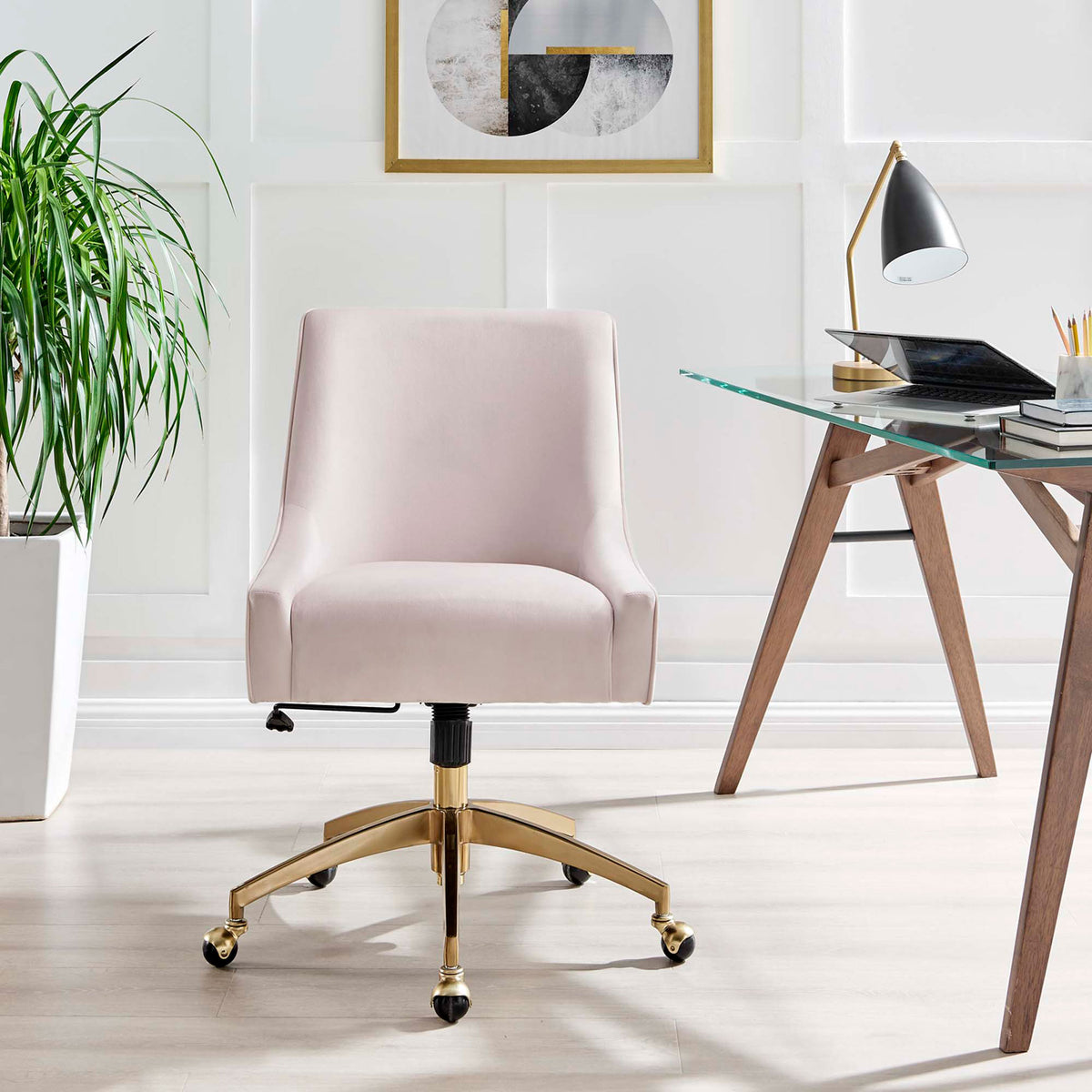 Pink velvet office chair centered at a minimalist home workspace with wood desk and decor accents || EEI-5079-PNK || front_room