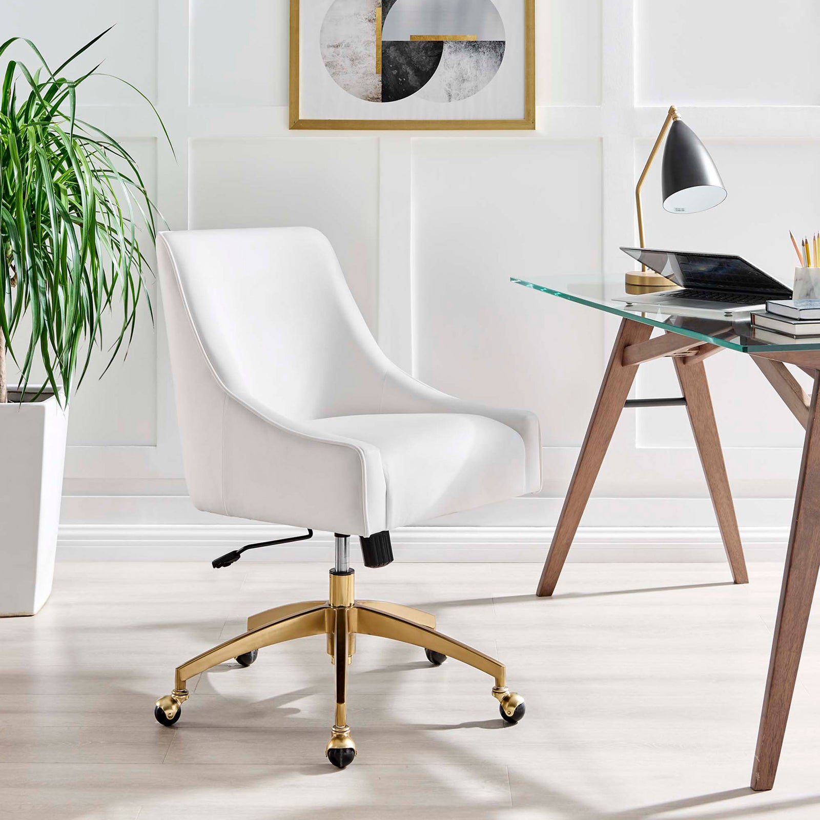 White velvet office chair with gold base styled beside a modern glass desk in a bright workspace || EEI-5079-WHI || front_angle_room