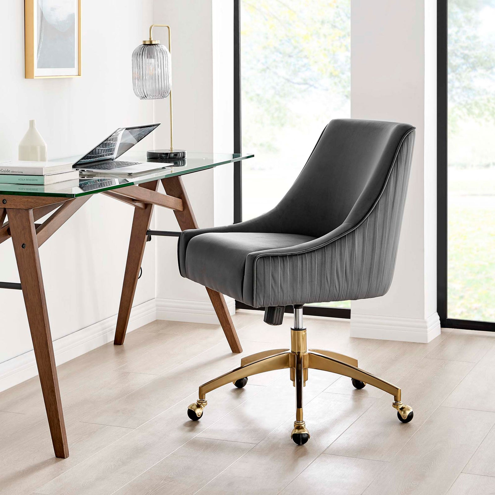 Gray velvet desk chair with pleated back and gold base beside a contemporary home office desk || EEI-5080-GRY || front_angle_room