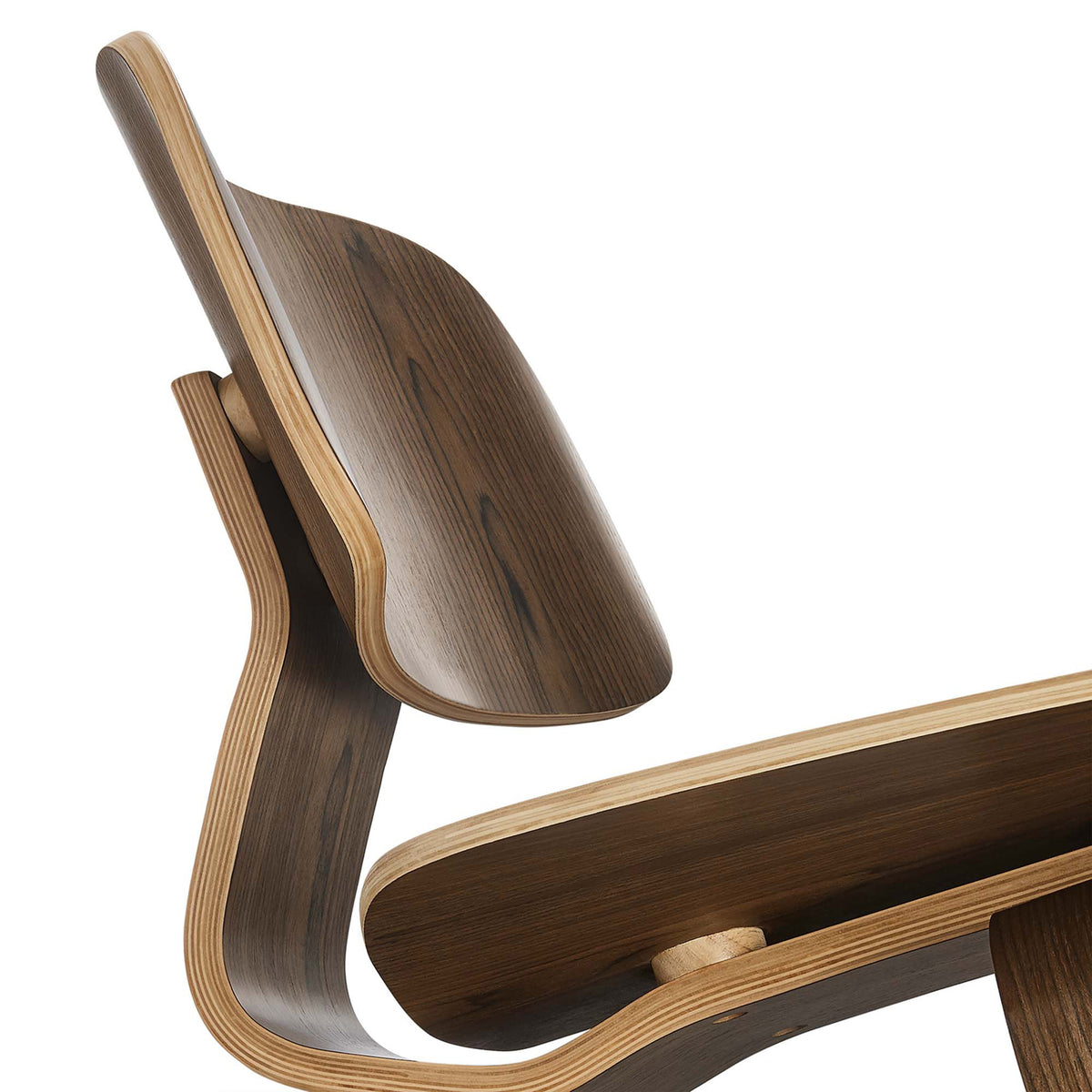 Layered plywood edges add contrast to the dark wood backrest and curved seat