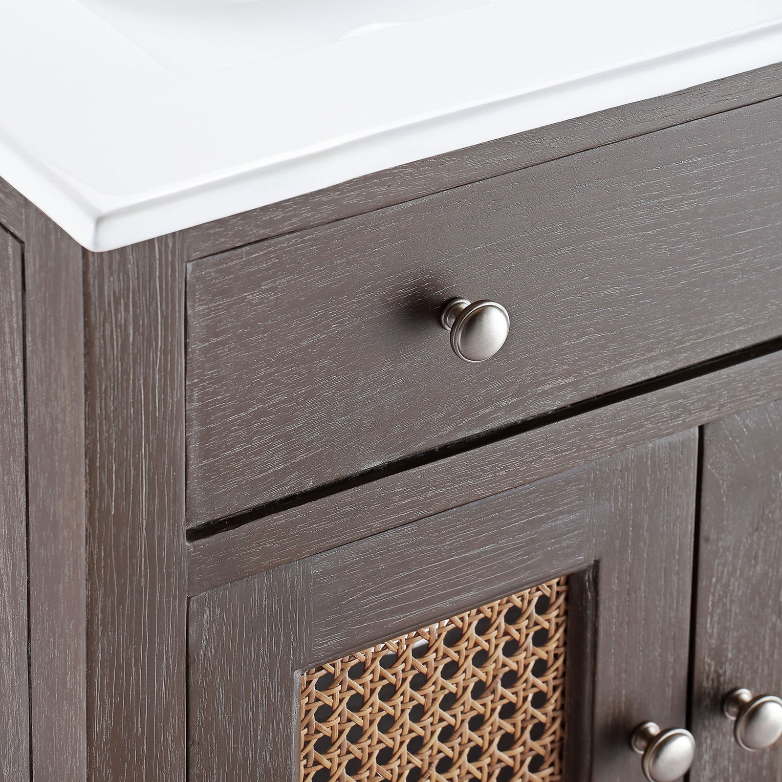 Brushed knobs and textured wood grain pair with airy rattan cane door panels. || EEI-5110-GRY-WHI || handle_studio