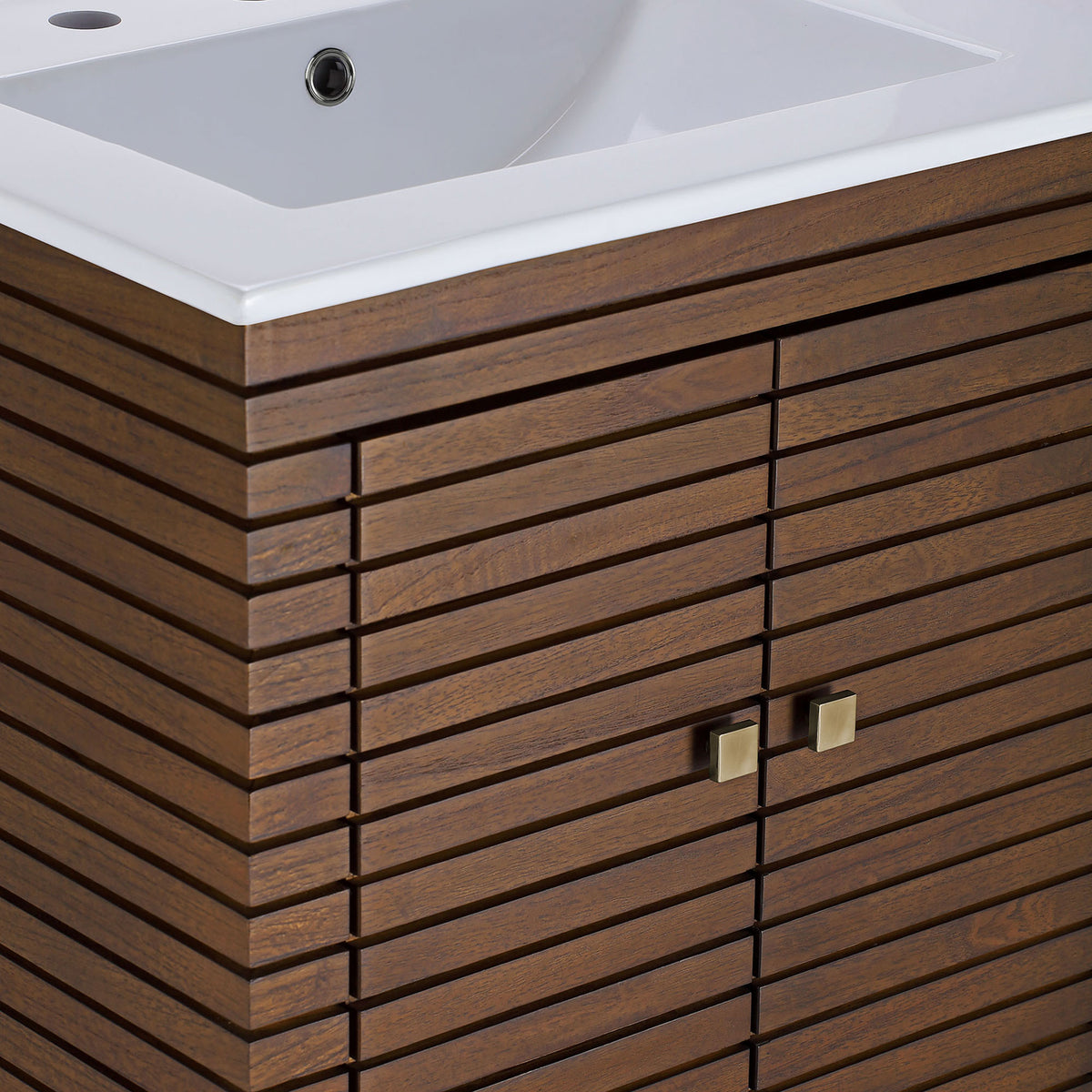 Square brass pulls accent the finely spaced slatted wood doors below the sink || EEI-5114-WAL-WHI || detail_studio