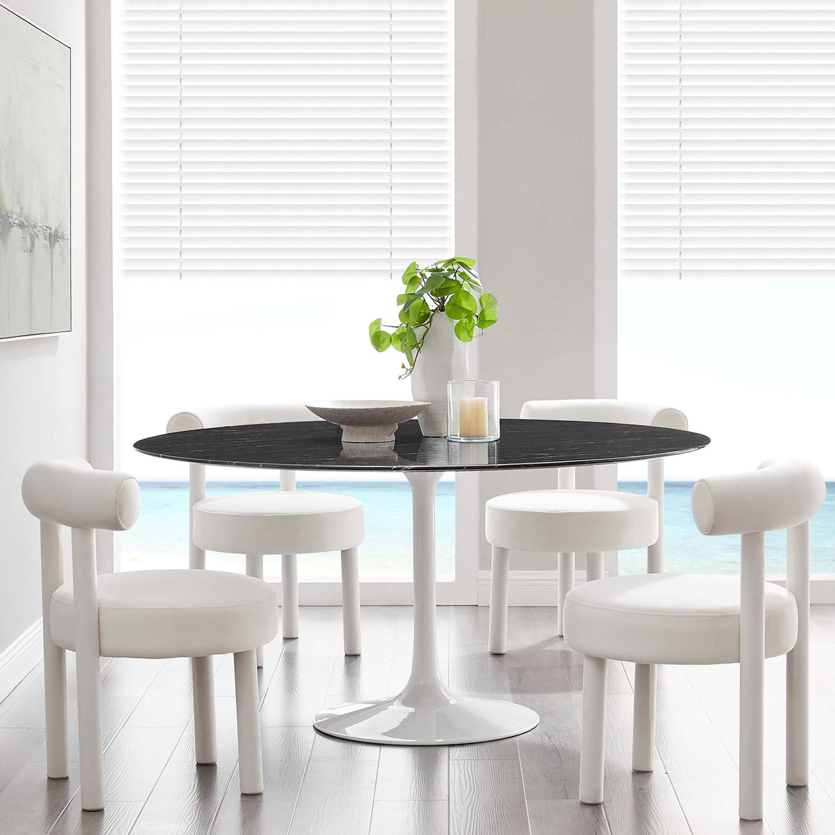 60 inch black faux marble dining table paired with white chairs in an airy coastal inspired room || EEI-5184-WHI-BLK || front_room