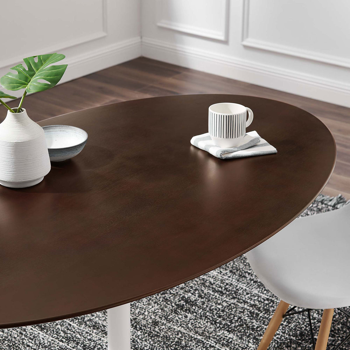 Cherry walnut tabletop styled with modern decor in a bright dining room setting || EEI-5194-WHI-CHE || detail_room