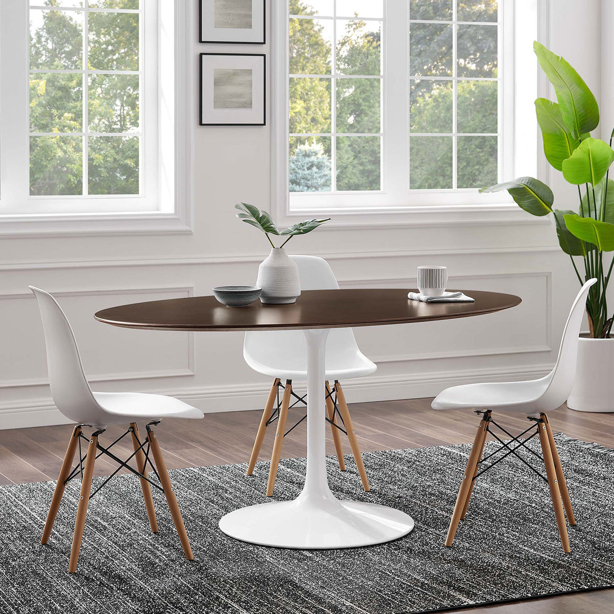 60 inch oval pedestal dining table with white chairs in a contemporary light filled room || EEI-5194-WHI-CHE || front_room