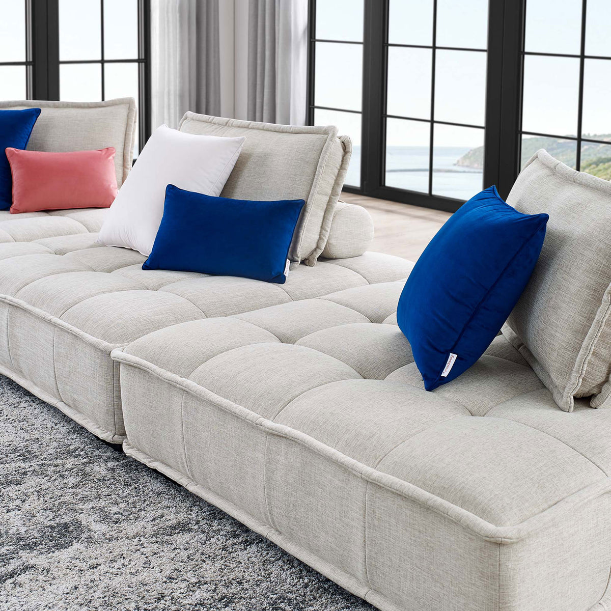 Saunter beige tufted sofa surface with soft upholstery and plush layered cushions for lounging comfort || EEI-5206-BEI || detail_room