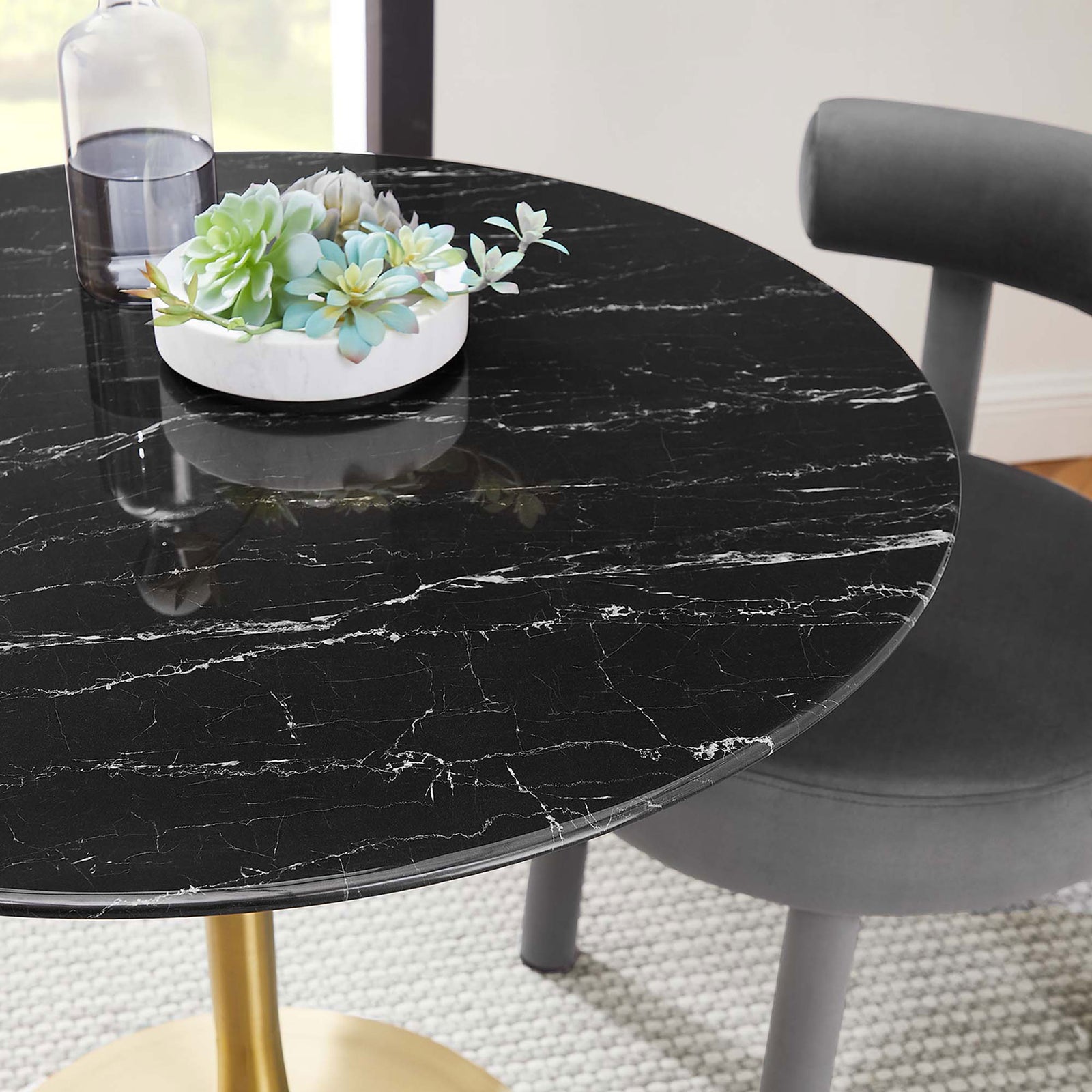 Black faux marble tabletop styled with greenery to showcase its white veining and smooth beveled edge || EEI-5225-GLD-BLK || detail_room