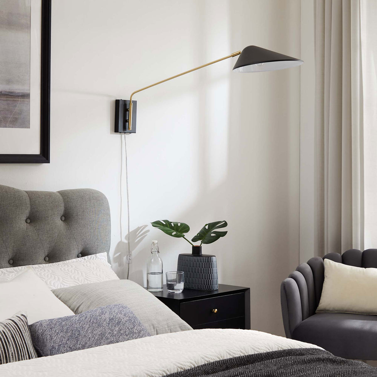 Extended swing arm sconce adds sculptural interest above a modern nightstand. || EEI-5295-BLK || front_angle_room