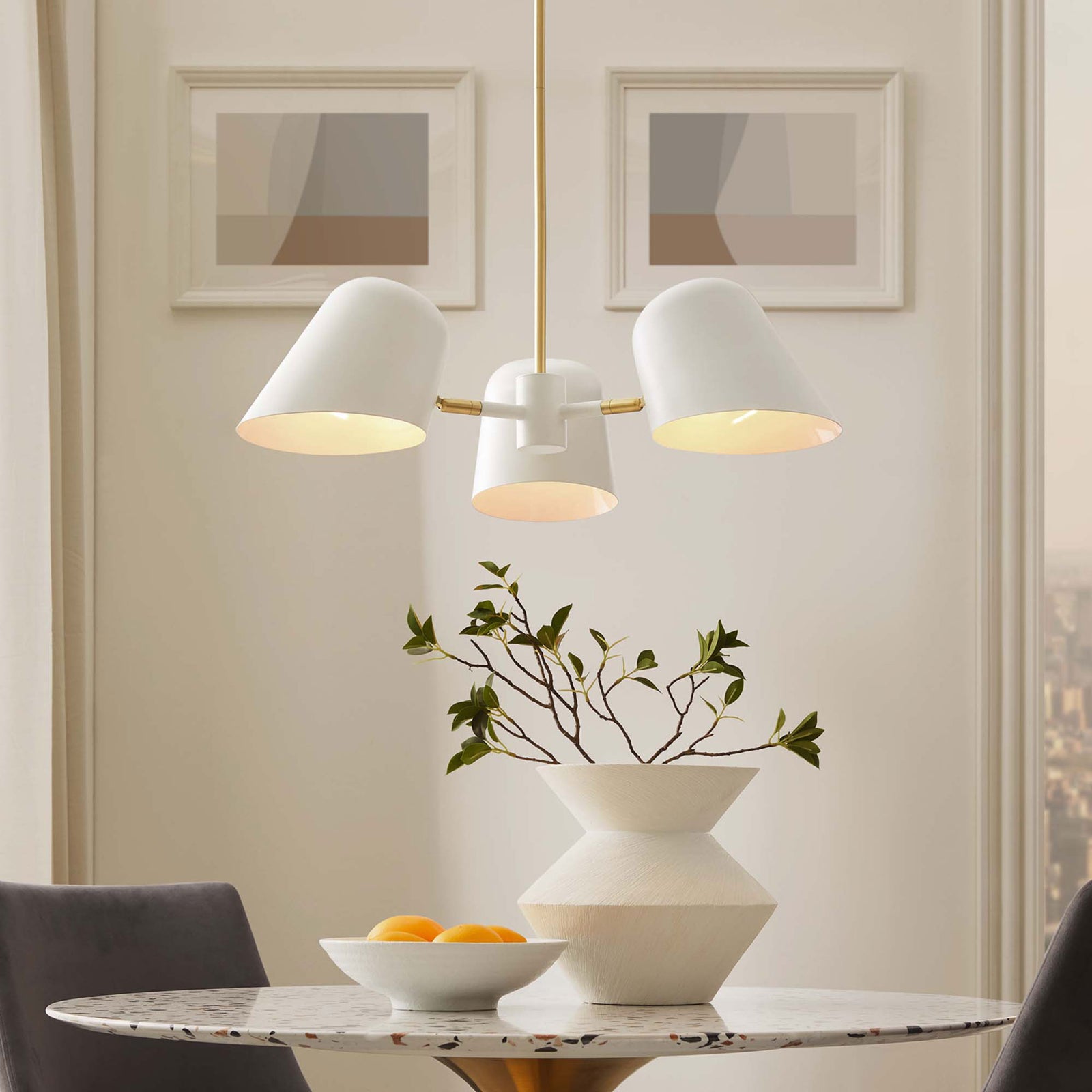 Warmly illuminated shades cast a cozy glow while the brass stem adds a touch of luxe || EEI-5301-WHI || front_on_room