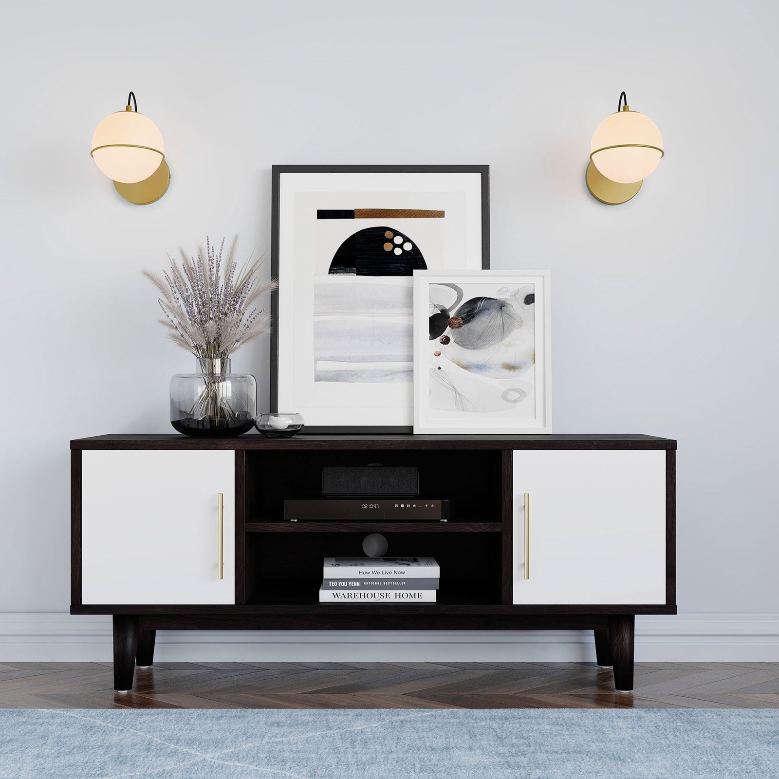 Pair of softly glowing opal globe sconces in satin brass adding warm light above a modern console || EEI-5308-OPA-GLD || front_on_room