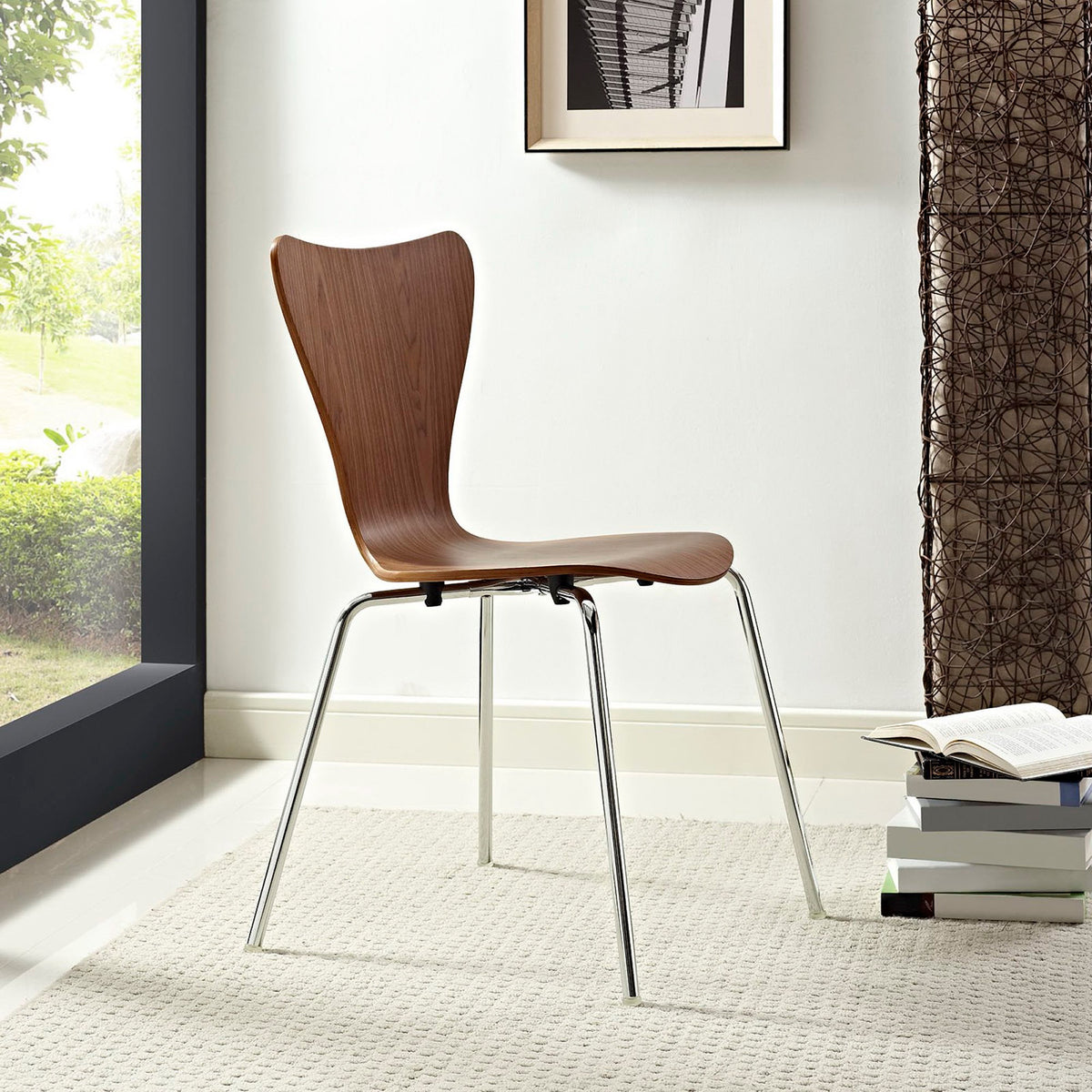 A walnut-tone bentwood chair pairs warm grain with chrome legs in a light-filled room.