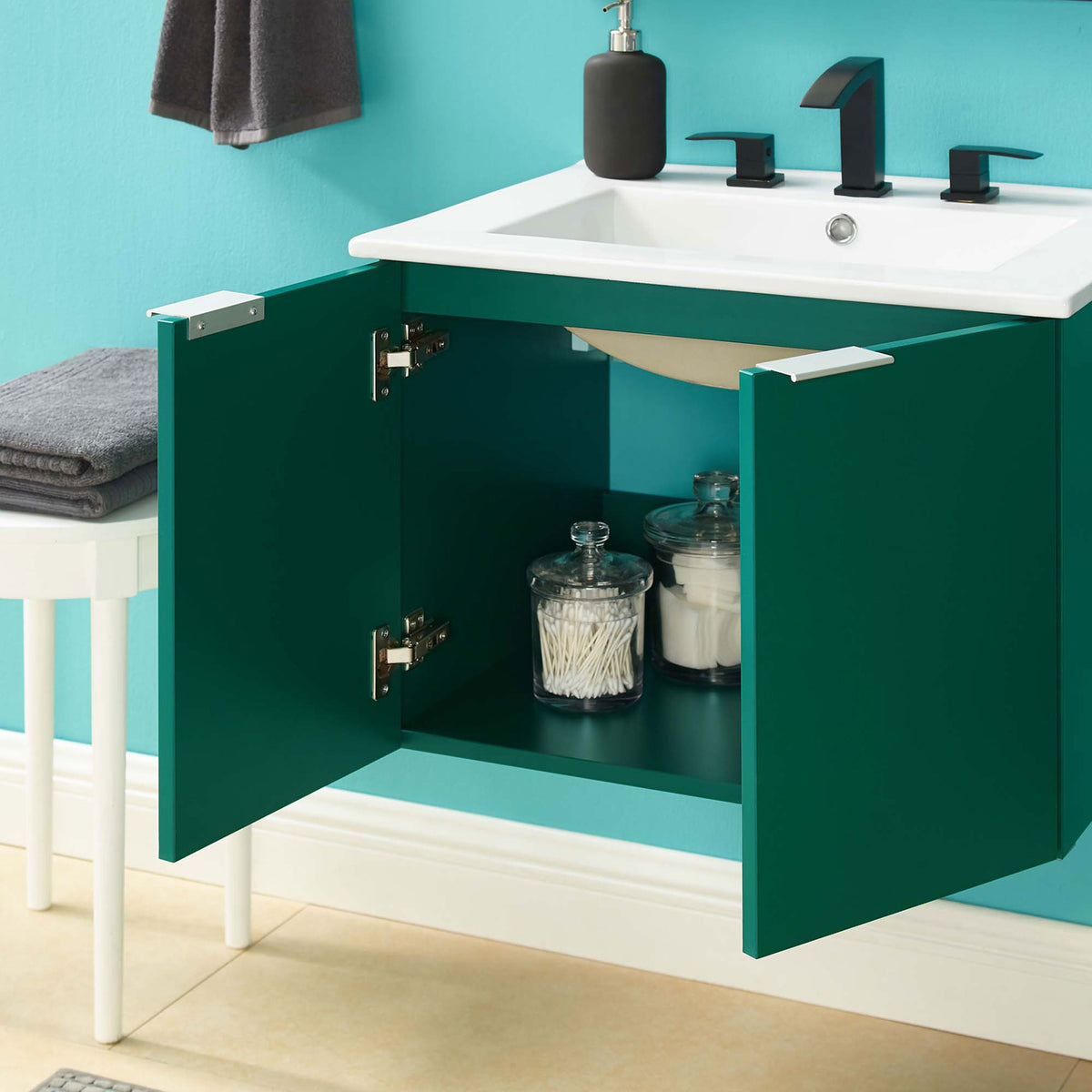 Open vanity doors showcase organized storage beneath the integrated white sink. || EEI-5379-GRN-WHI || front_open_room