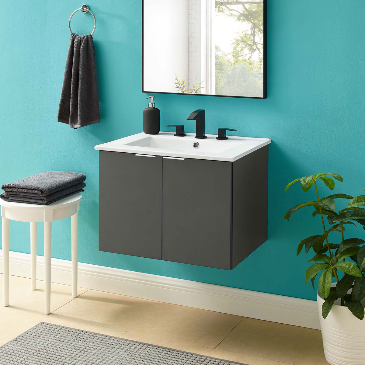 Floating vanity elevates the bath with a gray finish and bright white integrated sink || EEI-5379-GRY-WHI || front_room