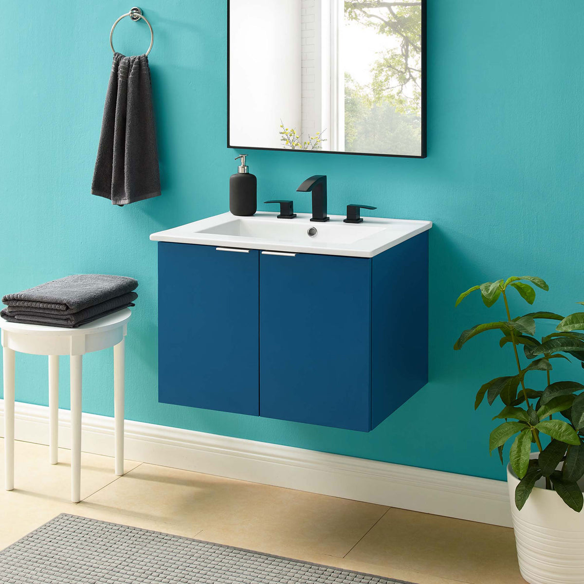 Modern wall-mounted navy vanity with white integrated sink and metal pulls || EEI-5379-NAV-WHI || front_room