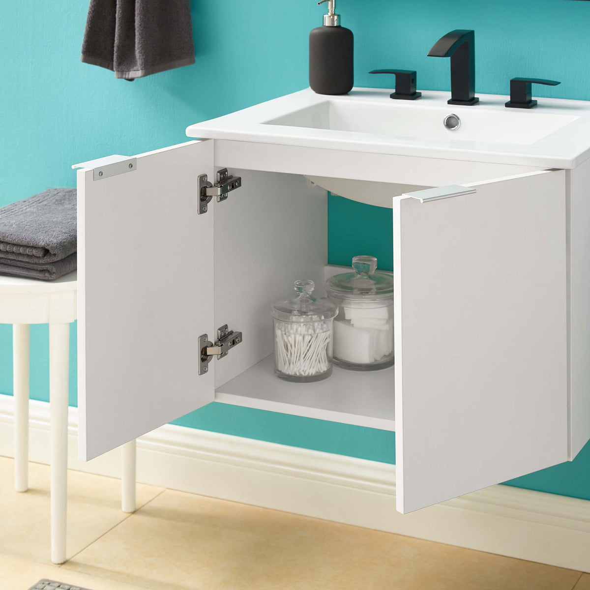 Wall-mounted vanity with doors open reveals convenient shelf storage || EEI-5379-WHI-WHI || front_open_room
