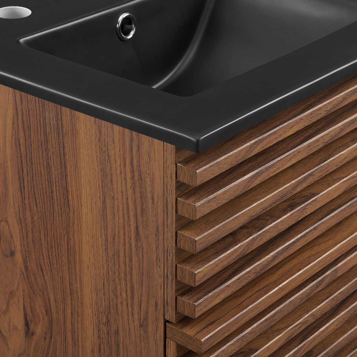Crisp ribbed drawer texture meets the soft radius of a matte black sink for refined contrast. || EEI-5390-WAL-BLK || detail_studio