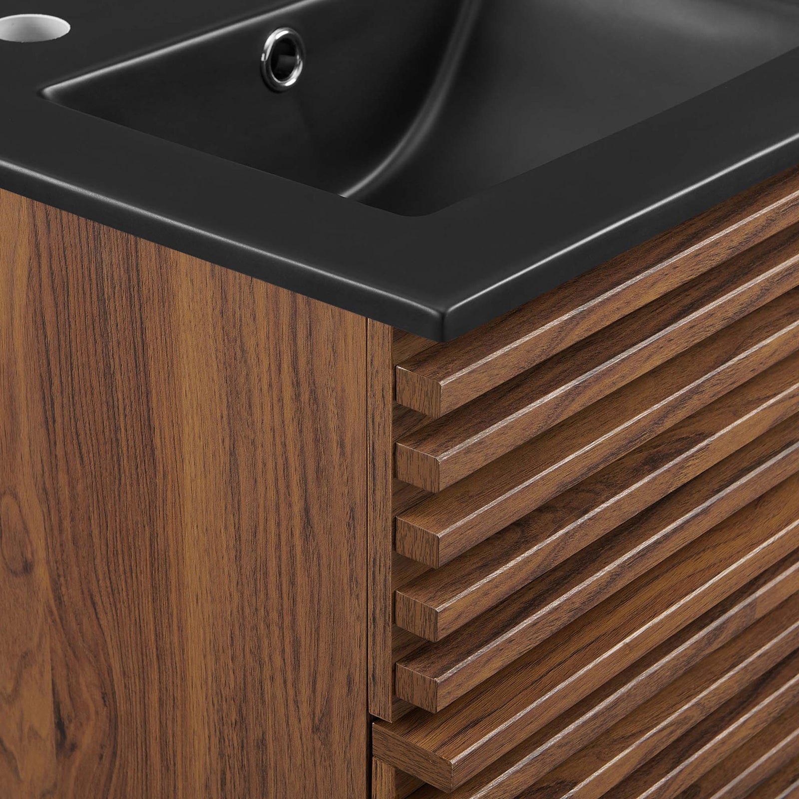 Crisp ribbed drawer texture meets the soft radius of a matte black sink for refined contrast. || EEI-5390-WAL-BLK || detail_studio