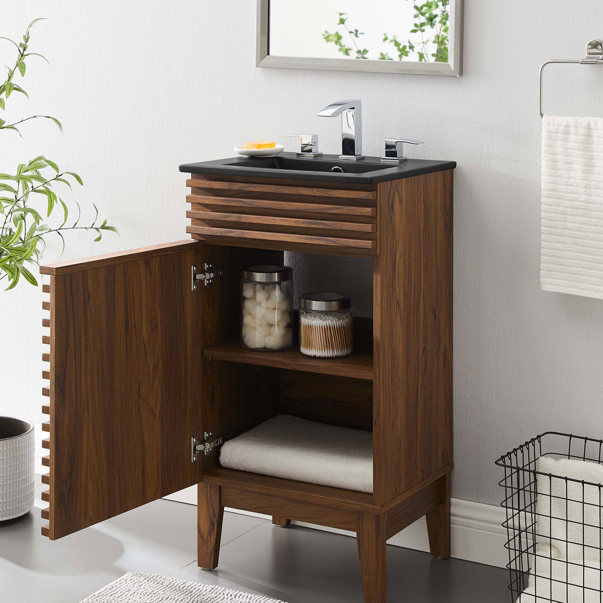 Open cabinet offers convenient storage for bath essentials in a clean, modern bathroom setting || EEI-5391-WAL-BLK || front_angle_open_room