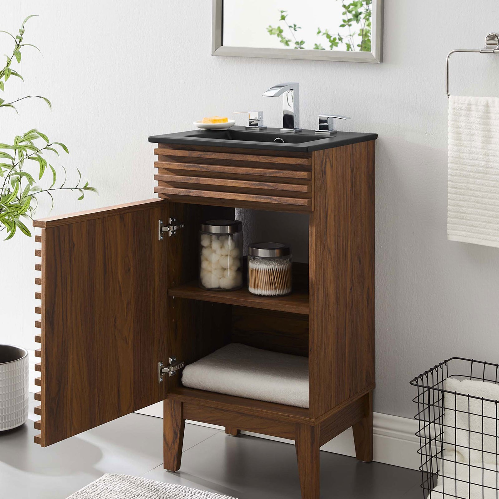 Open cabinet offers convenient storage for bath essentials in a clean, modern bathroom setting || EEI-5391-WAL-BLK || front_angle_open_room