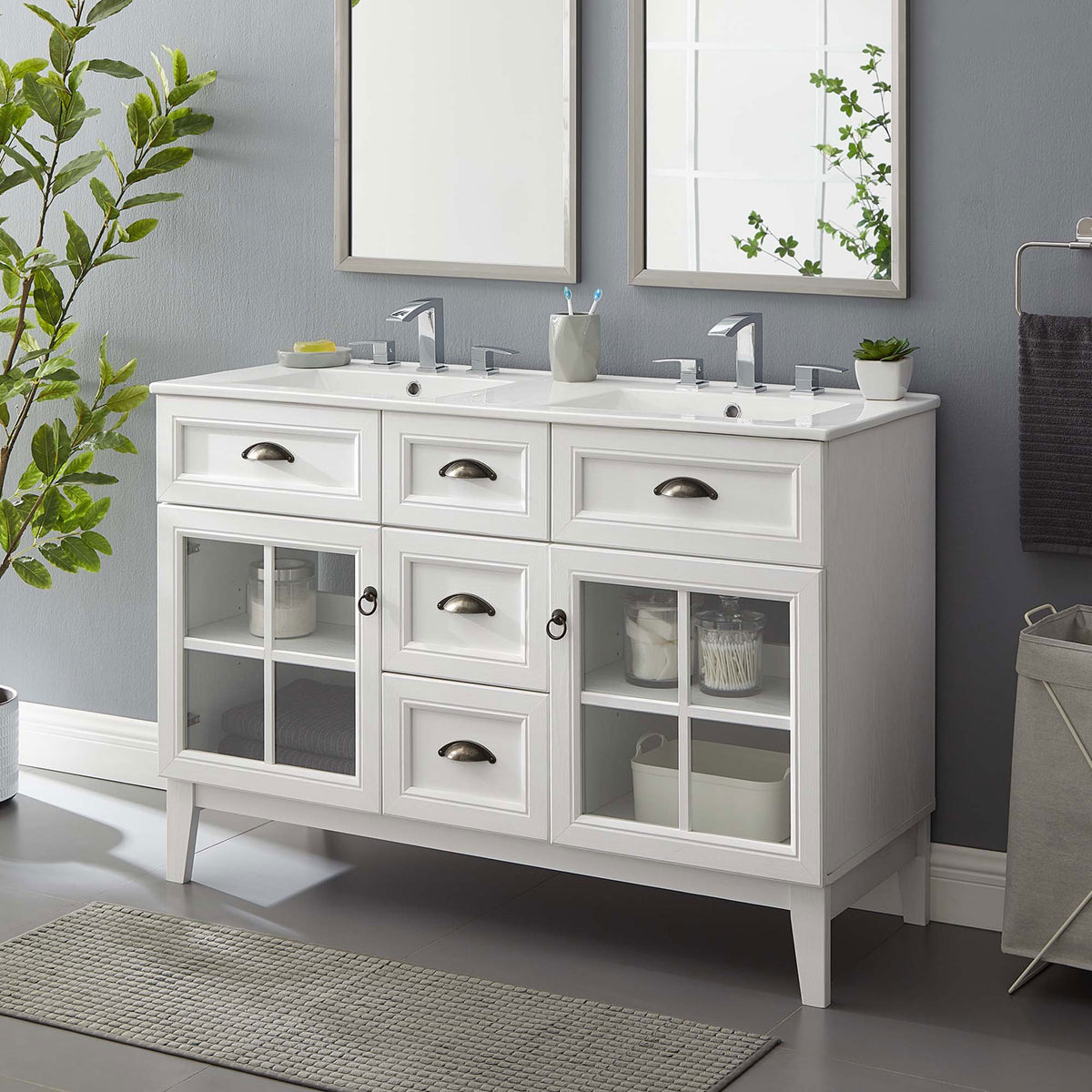Refined double vanity anchors the bath with bright storage display and integrated twin sinks || EEI-5428-WHI-WHI || front_angle_room
