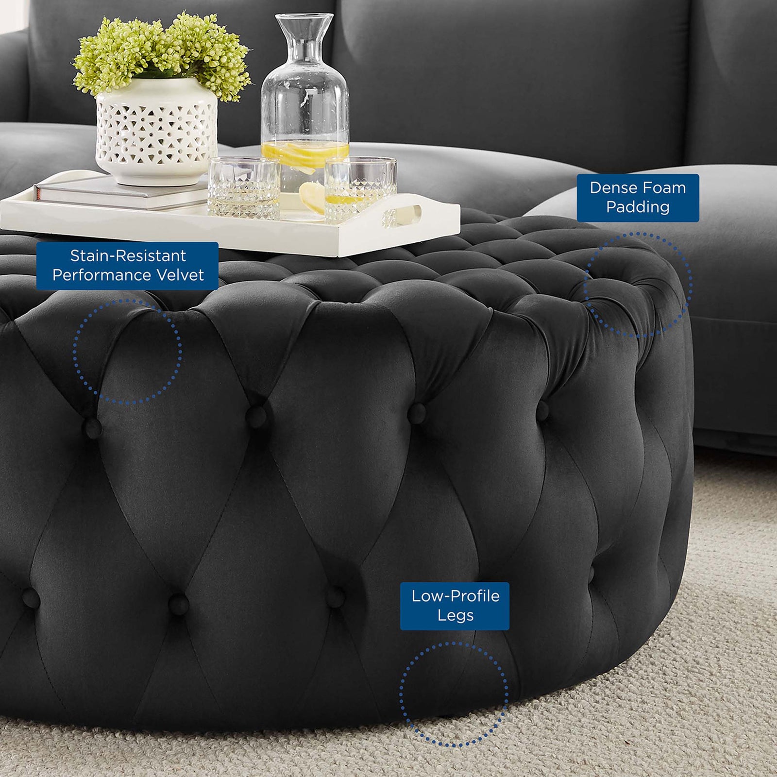 Lifestyle scene highlighting the ottoman's stain-resistant velvet, dense foam padding, and low-profile legs || EEI-5469-BLK || callout_room