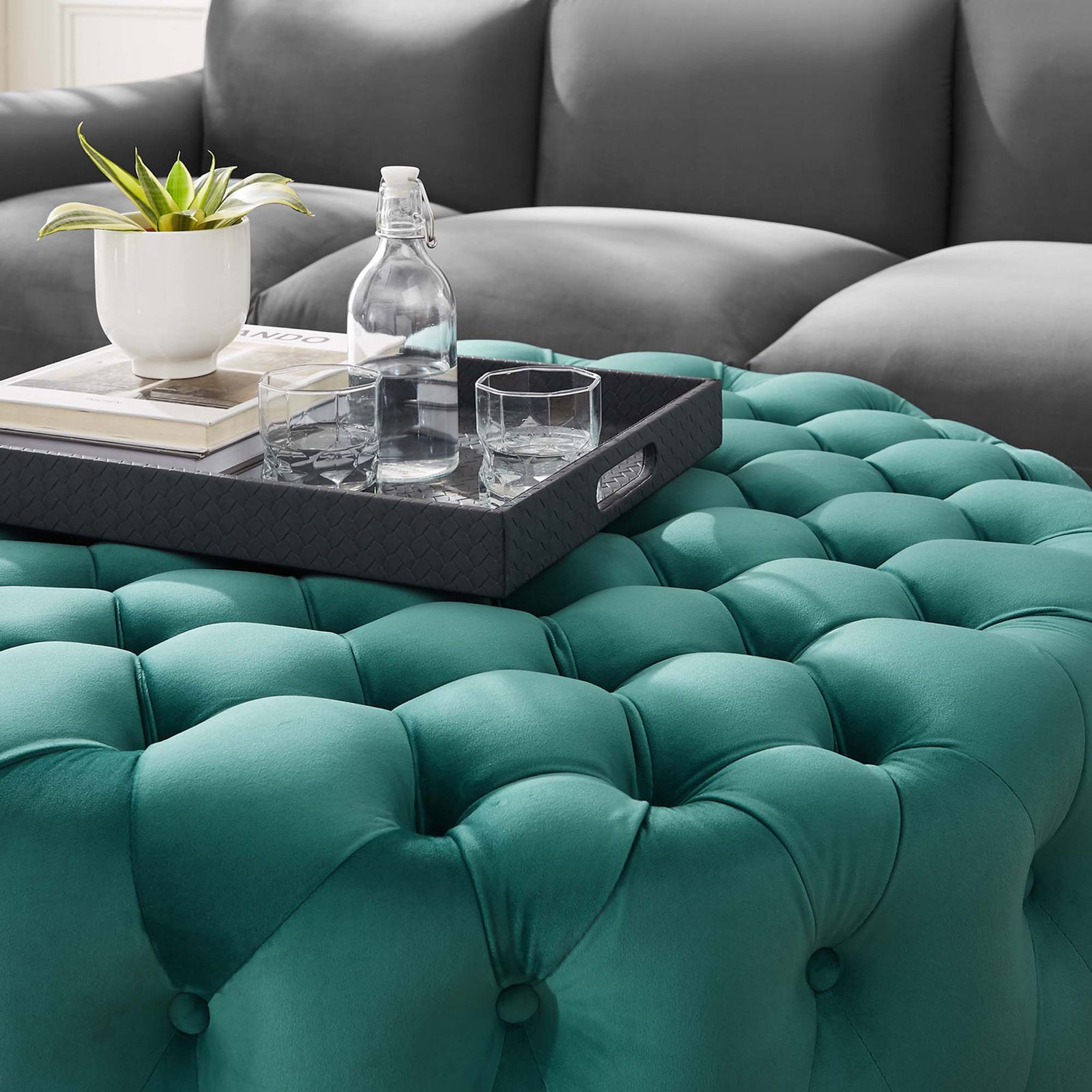Teal velvet ottoman styled with a tray, plant, and glassware to highlight its tufted comfort || EEI-5469-TEA || detail_room