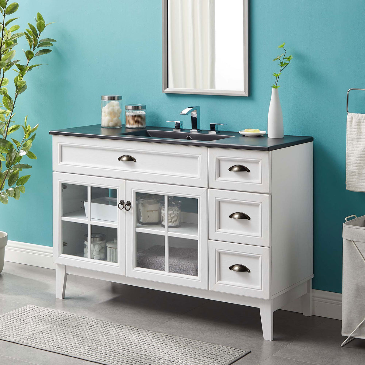 Crisp white cabinet contrasts a deep black top for a fresh, modern bath centerpiece || EEI-5479-WHI-BLK || front_angle_room